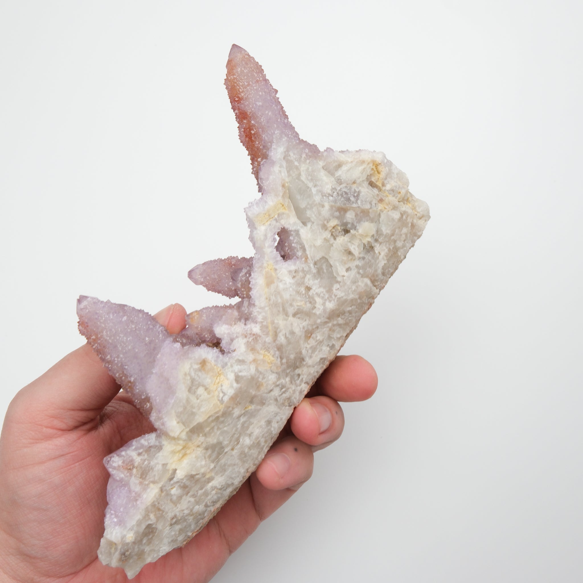 Natural spirit quartz cluster with clear, pointed crystals and vibrant energy, displayed on a neutral background.