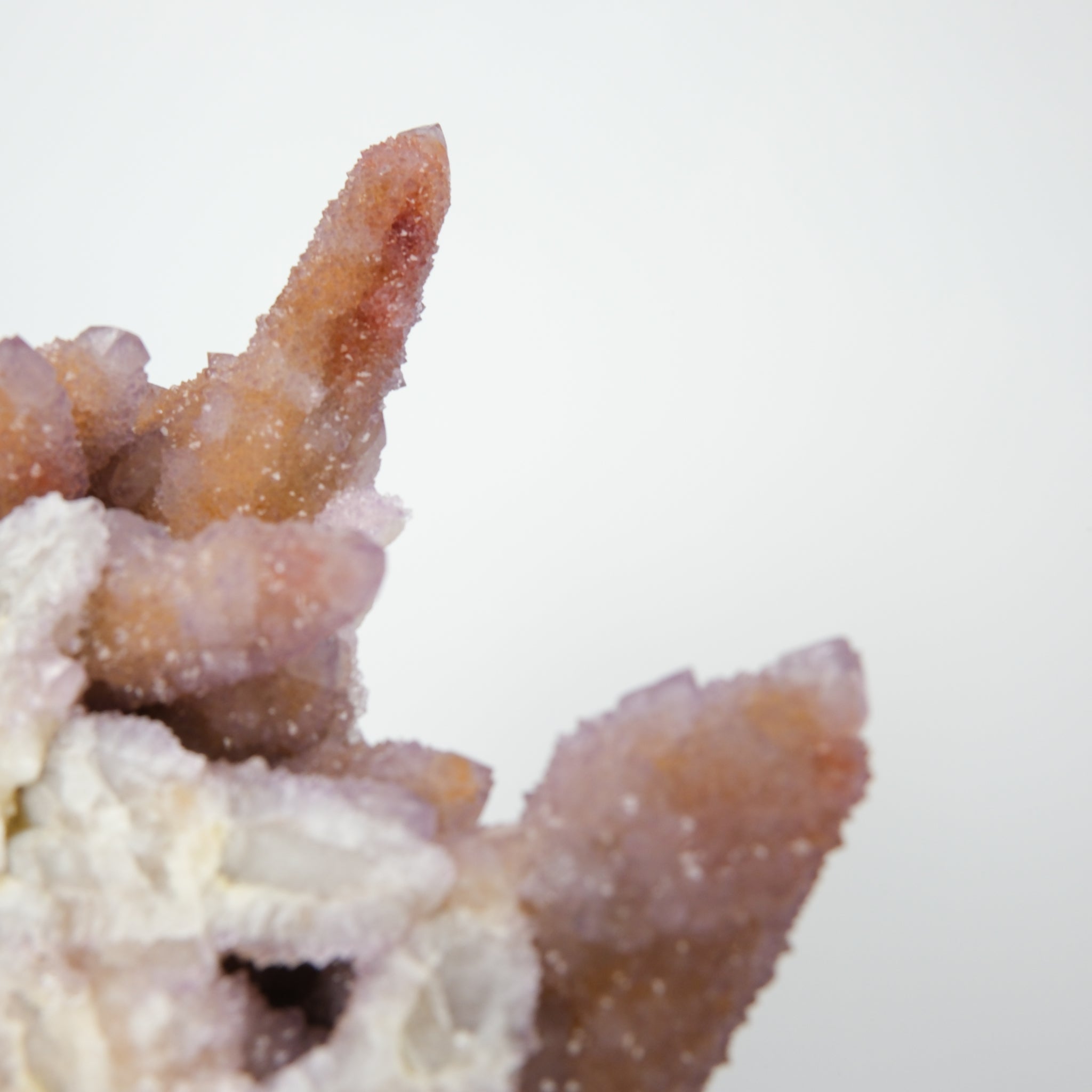 Noctis Studio Spirit Quartz Cluster with multiple clear, lavender-tinted quartz points arranged in a natural mineral formation.