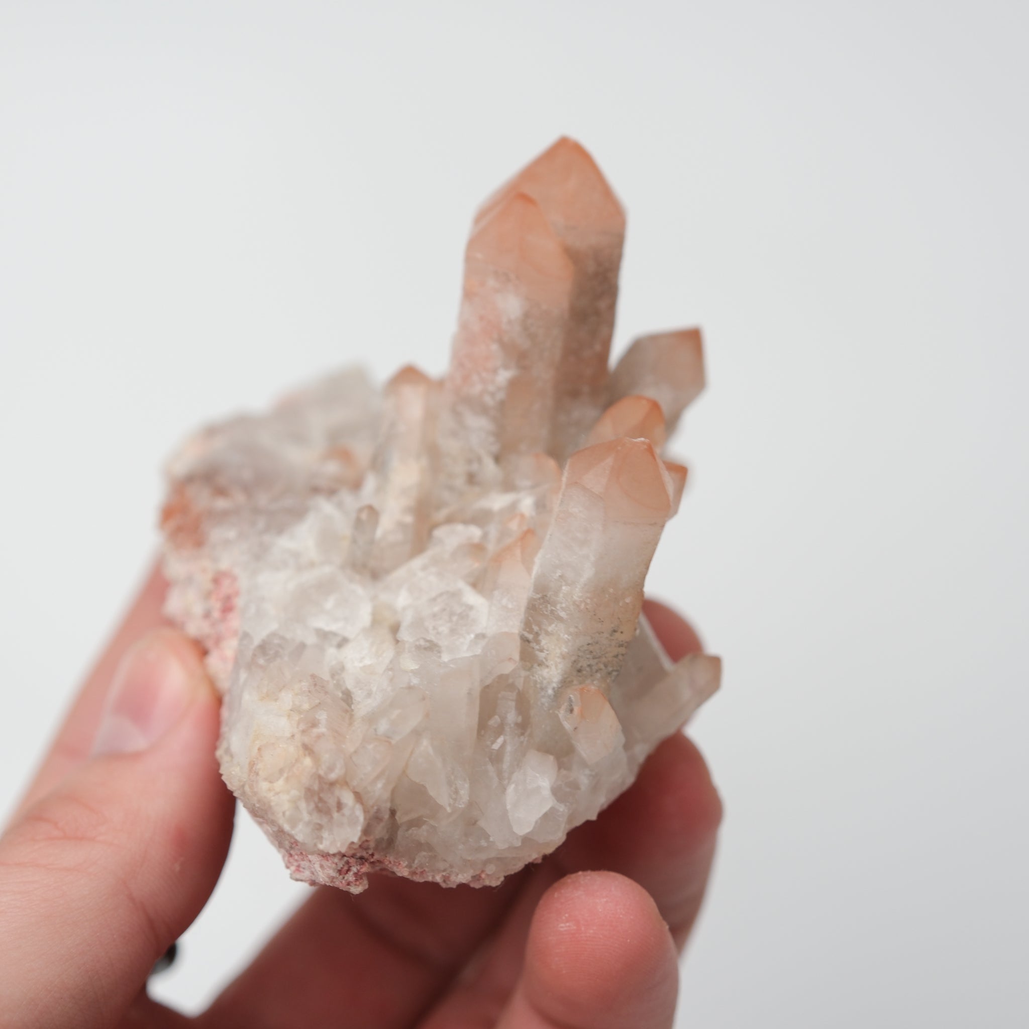 Orange River Quartz cluster from Noctis Studio showcasing vibrant orange mineral formations and clear quartz points.
