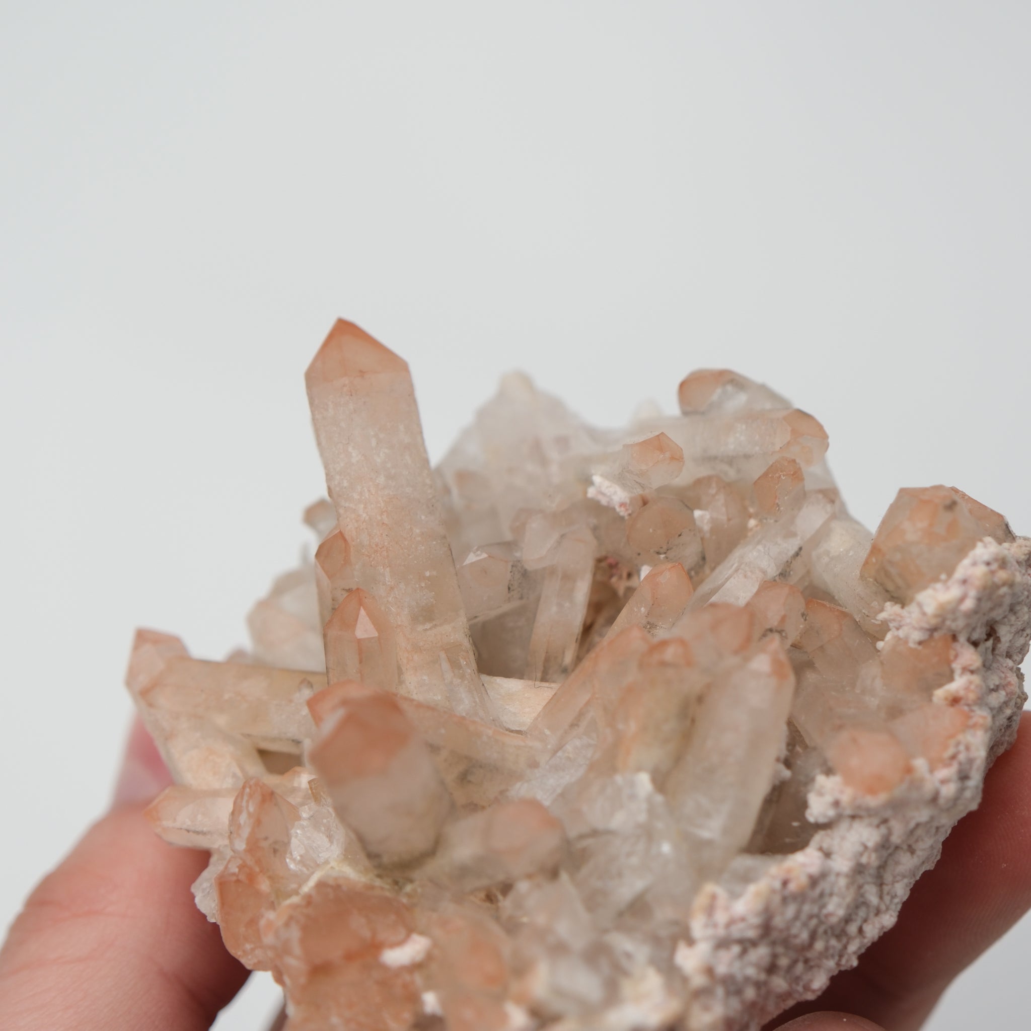 Orange River quartz cluster by Noctis Studio showing vibrant orange mineral formations with natural crystalline structure.