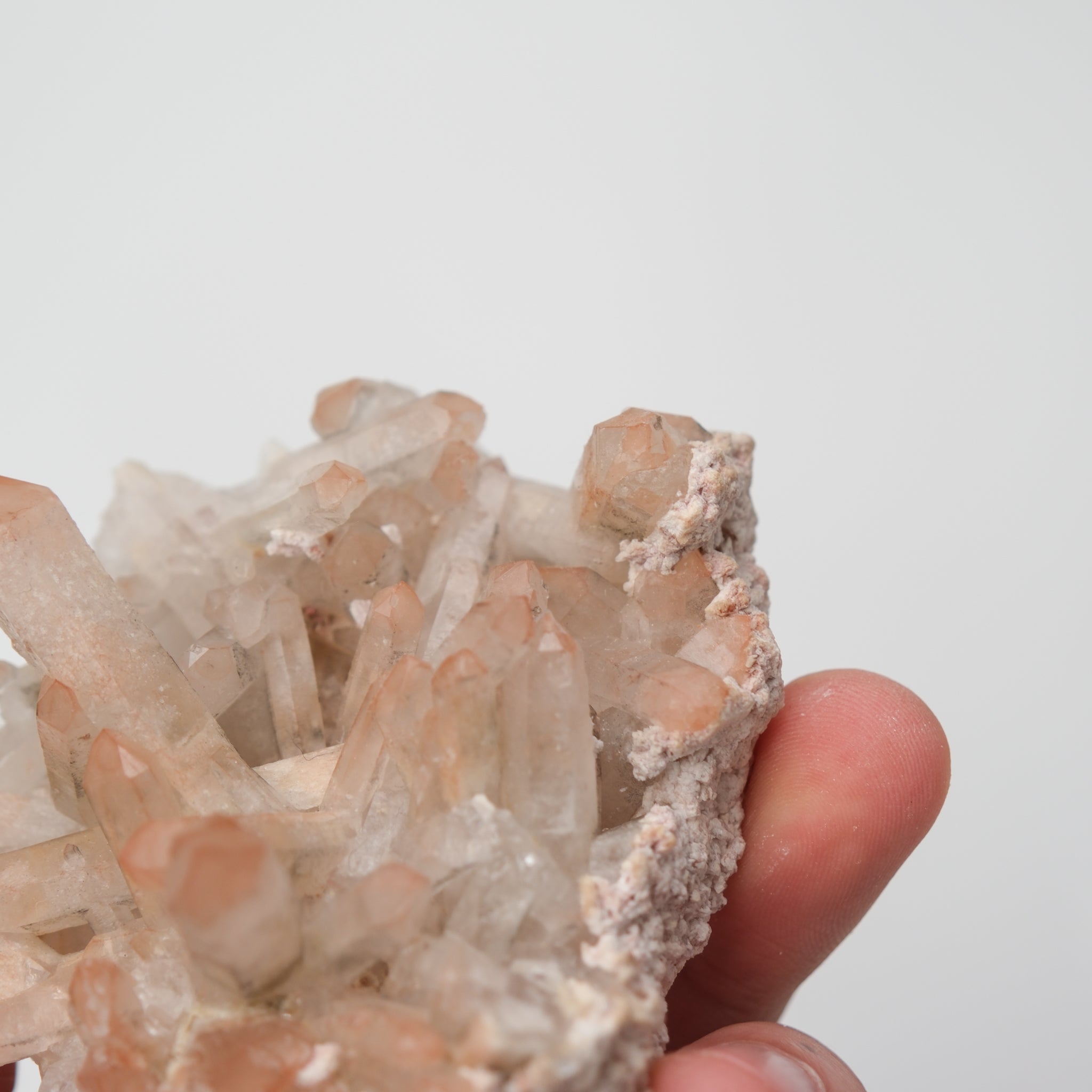 Orange River Quartz Cluster from Noctis Studio, showcasing vibrant orange and clear quartz crystals in a natural mineral formation.