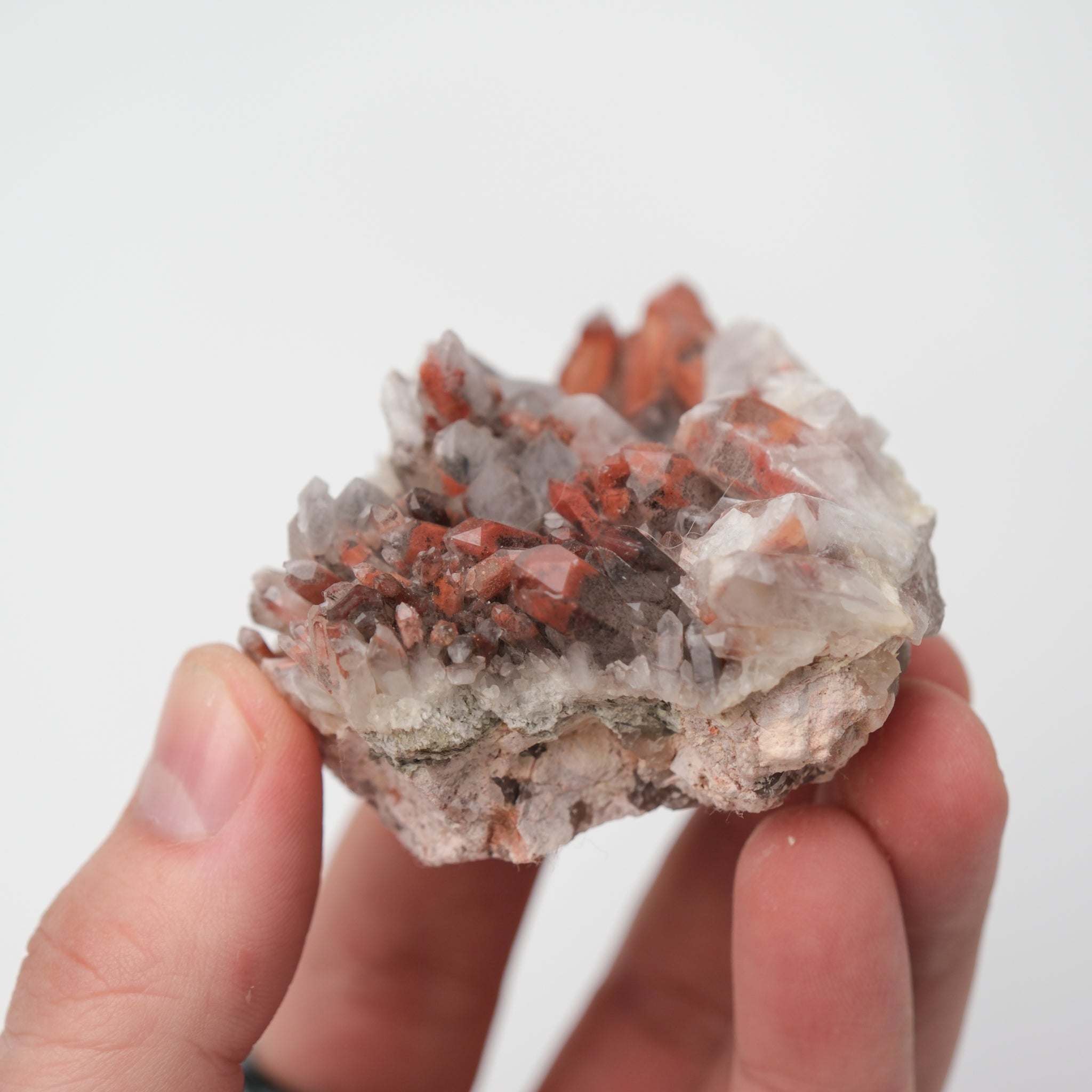 Orange River Quartz Cluster from Noctis Studio showcasing vibrant orange crystals and natural mineral formation.