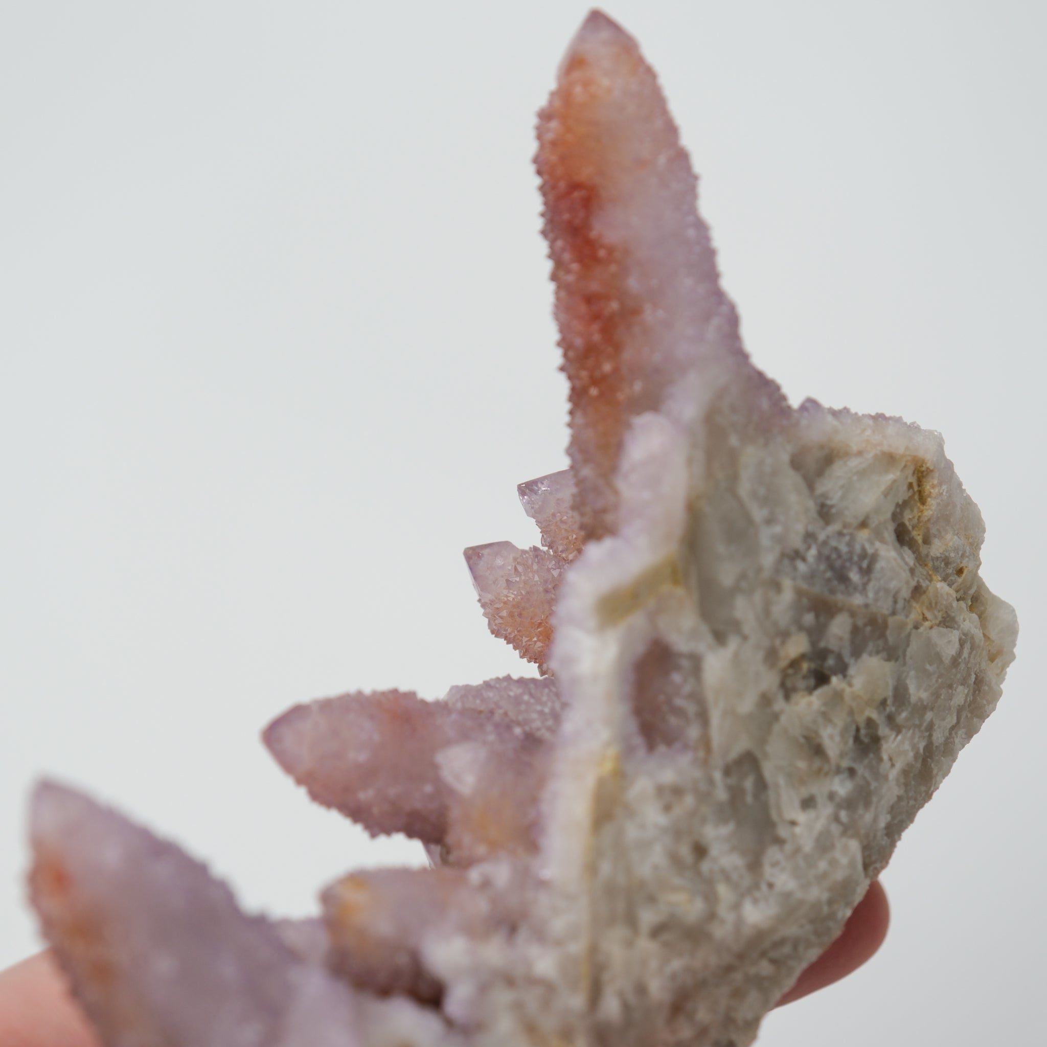 Noctis Studio Spirit Quartz Cluster with multiple clear, lavender-hued quartz points arranged in a natural mineral formation.