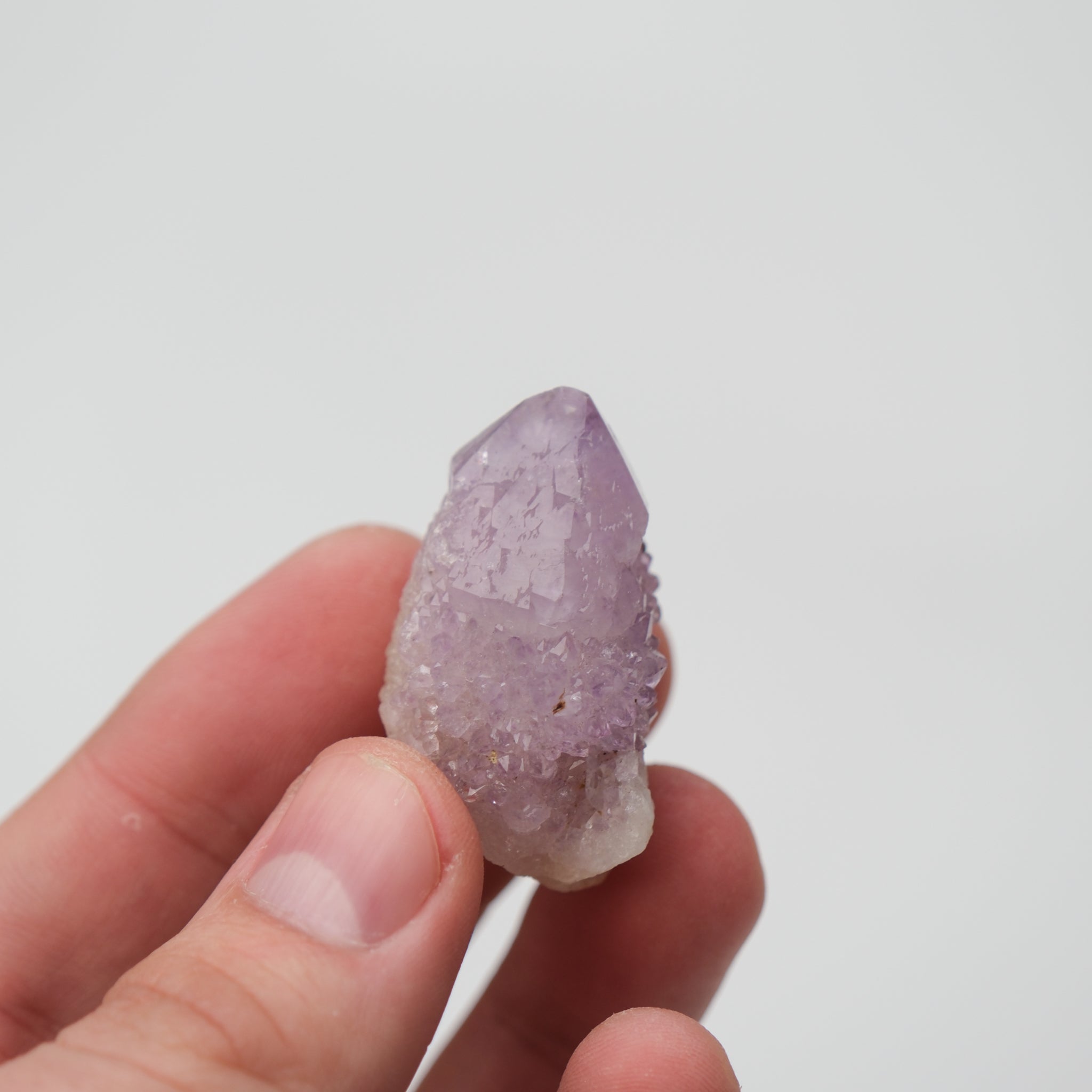 Noctis Studio Spirit Quartz cluster with multiple clear, pointed crystal formations on a natural base.