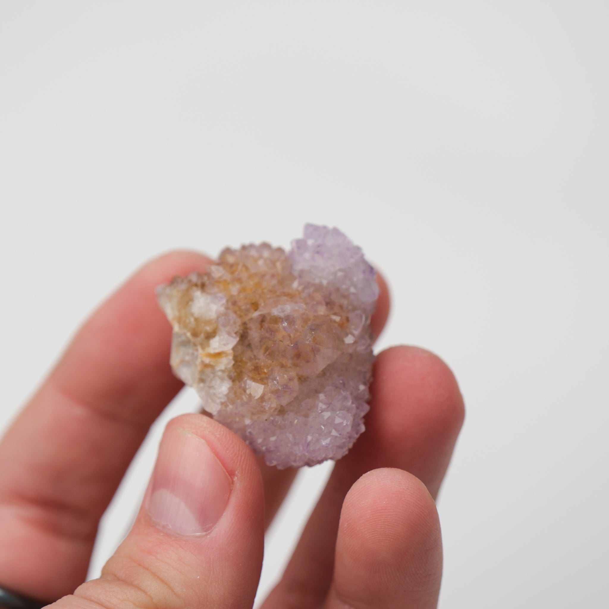 Natural Spirit Quartz cluster from Noctis Studio with transparent quartz points radiating outward, showcasing intricate crystal formations.