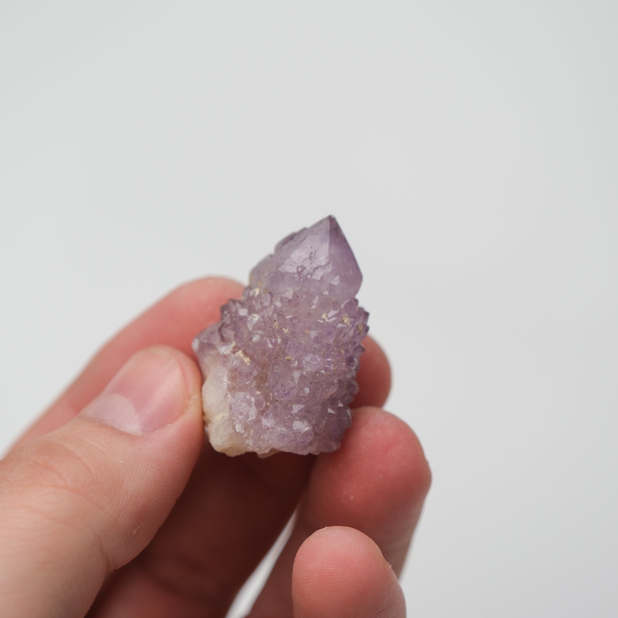 Noctis Studio Spirit Quartz cluster with multiple clear, prismatic crystals arranged in a natural formation.