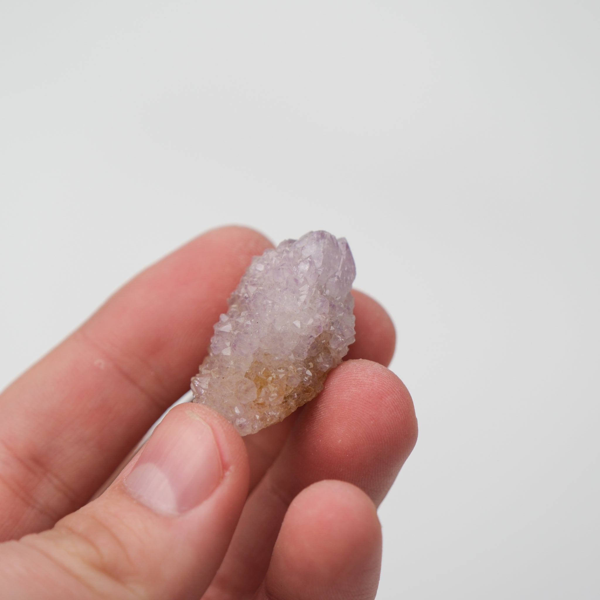 Noctis Studio Spirit Quartz cluster with clear, hexagonal crystals arranged in a vibrant, natural mineral formation.