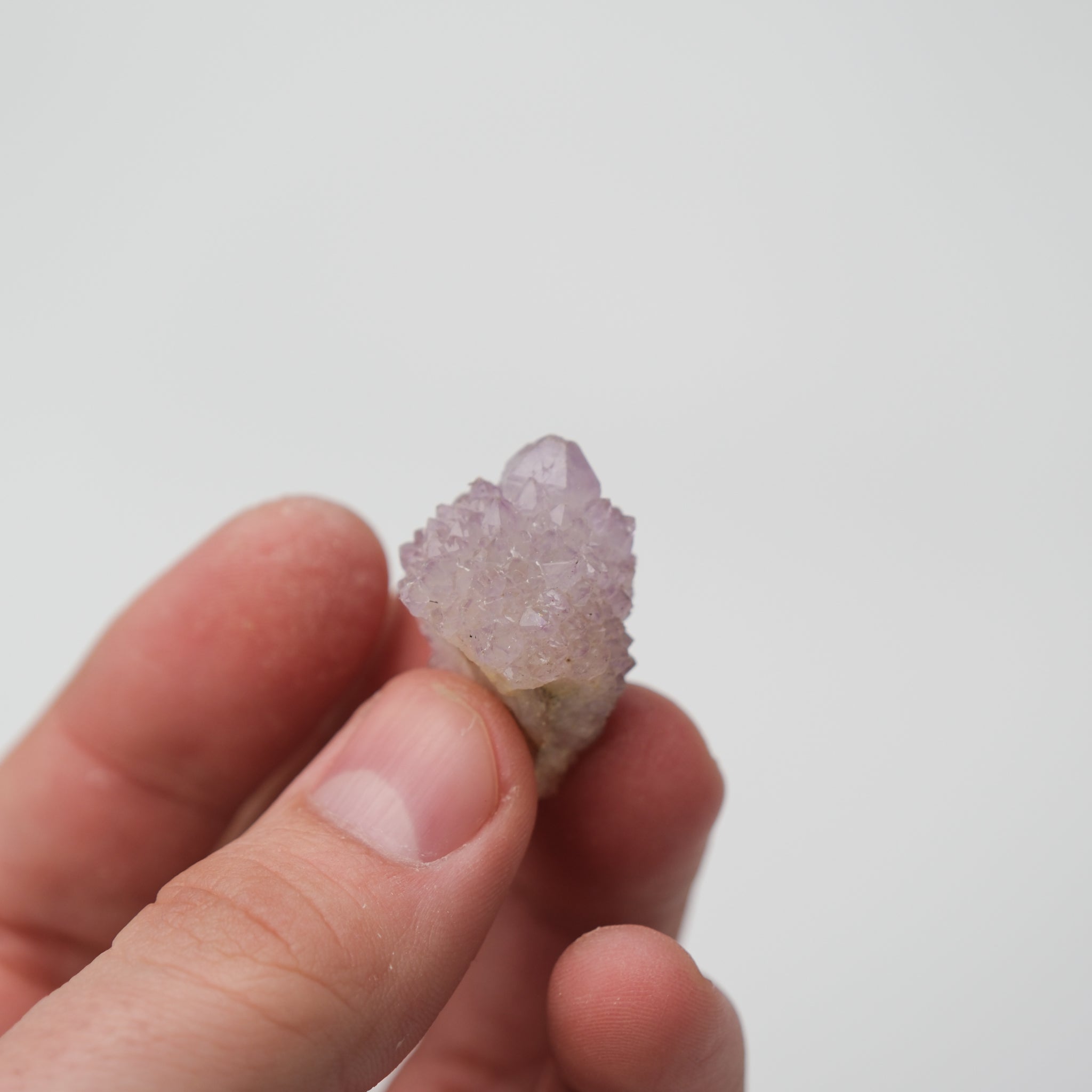 Close-up of Noctis Studio Spirit Quartz cluster with clear, crystalline formations and vibrant natural colors.