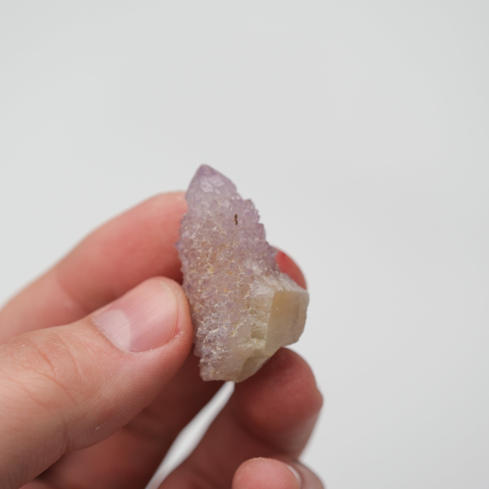 Noctis Studio Spirit Quartz cluster featuring multiple translucent, violet-hued crystals with intricate formations and natural sparkle.