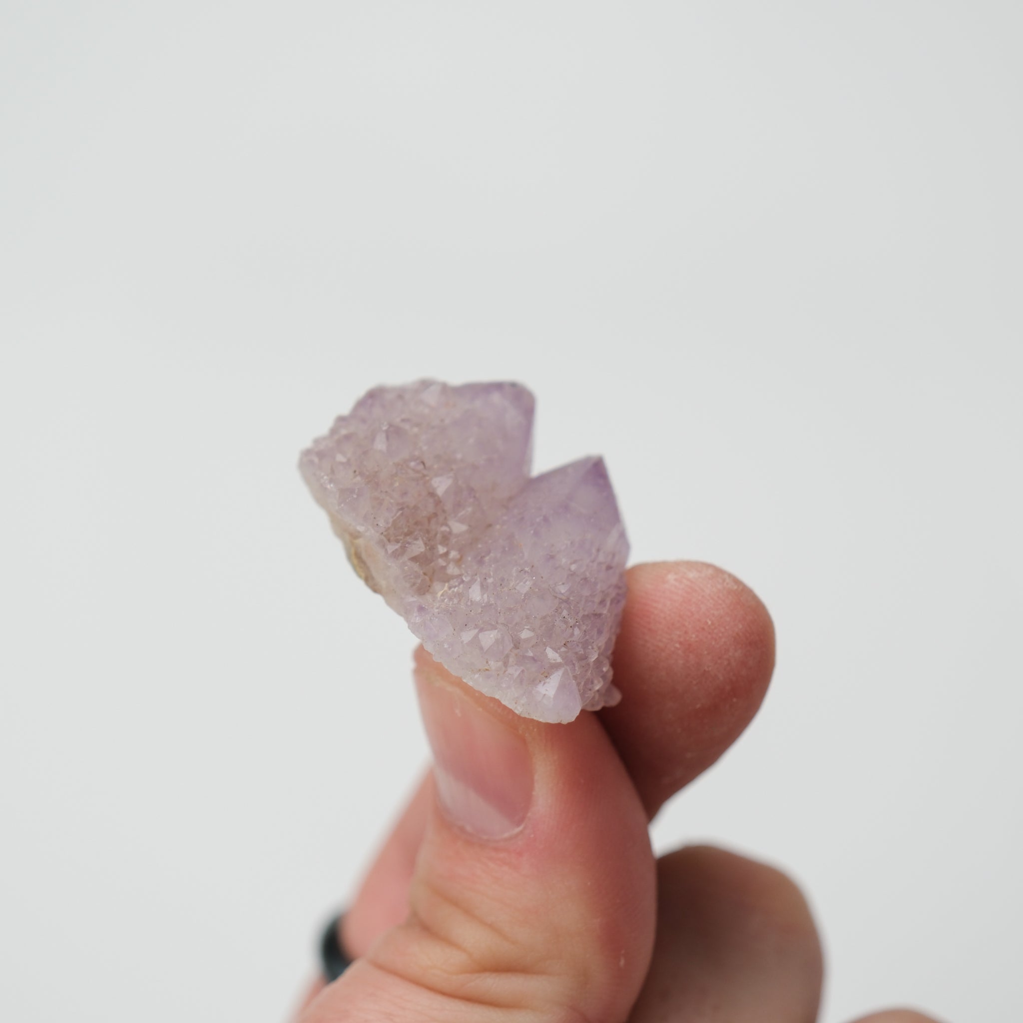Noctis Studio Spirit Quartz cluster displaying clear, elongated crystal formations in a natural mineral setting.