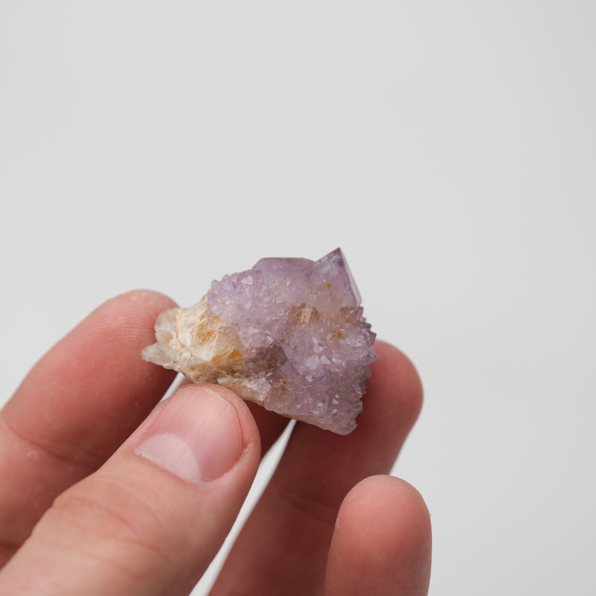 Noctis Studio Spirit Quartz cluster showing multiple clear, hexagonal crystal formations with a vibrant, natural appearance.