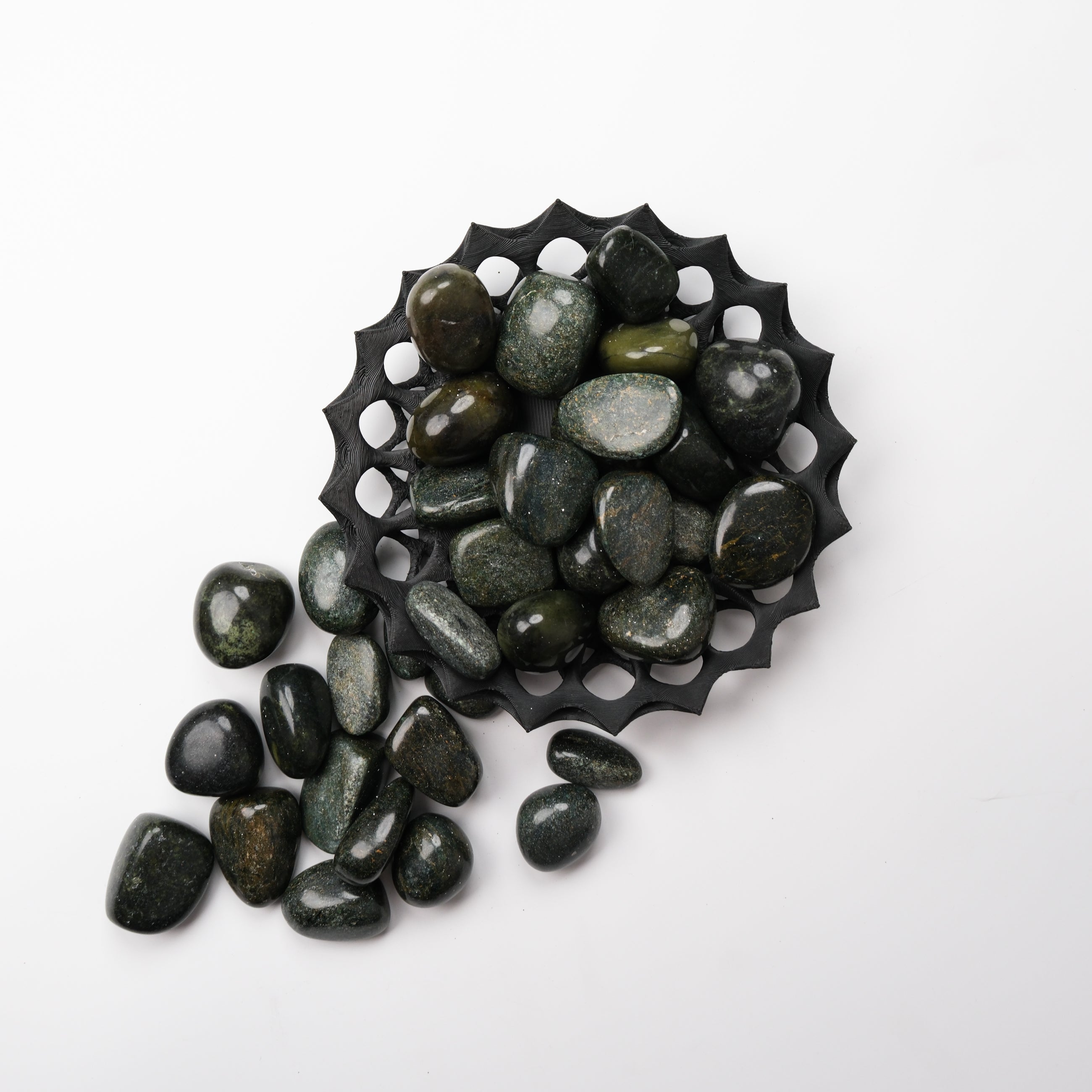 Noctis Studio Verdite tumble stone, smooth polished green gemstone with natural veining, used for meditation and decorative purposes.