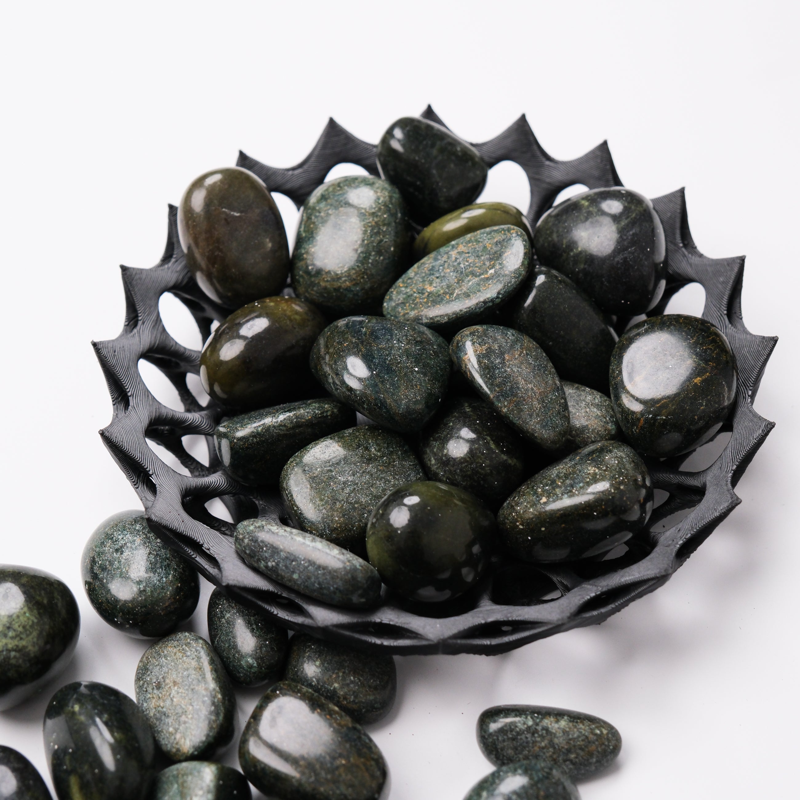 Verdite tumble stone by Noctis Studio, showcasing smooth, polished green gemstone with natural variations and unique patterns.