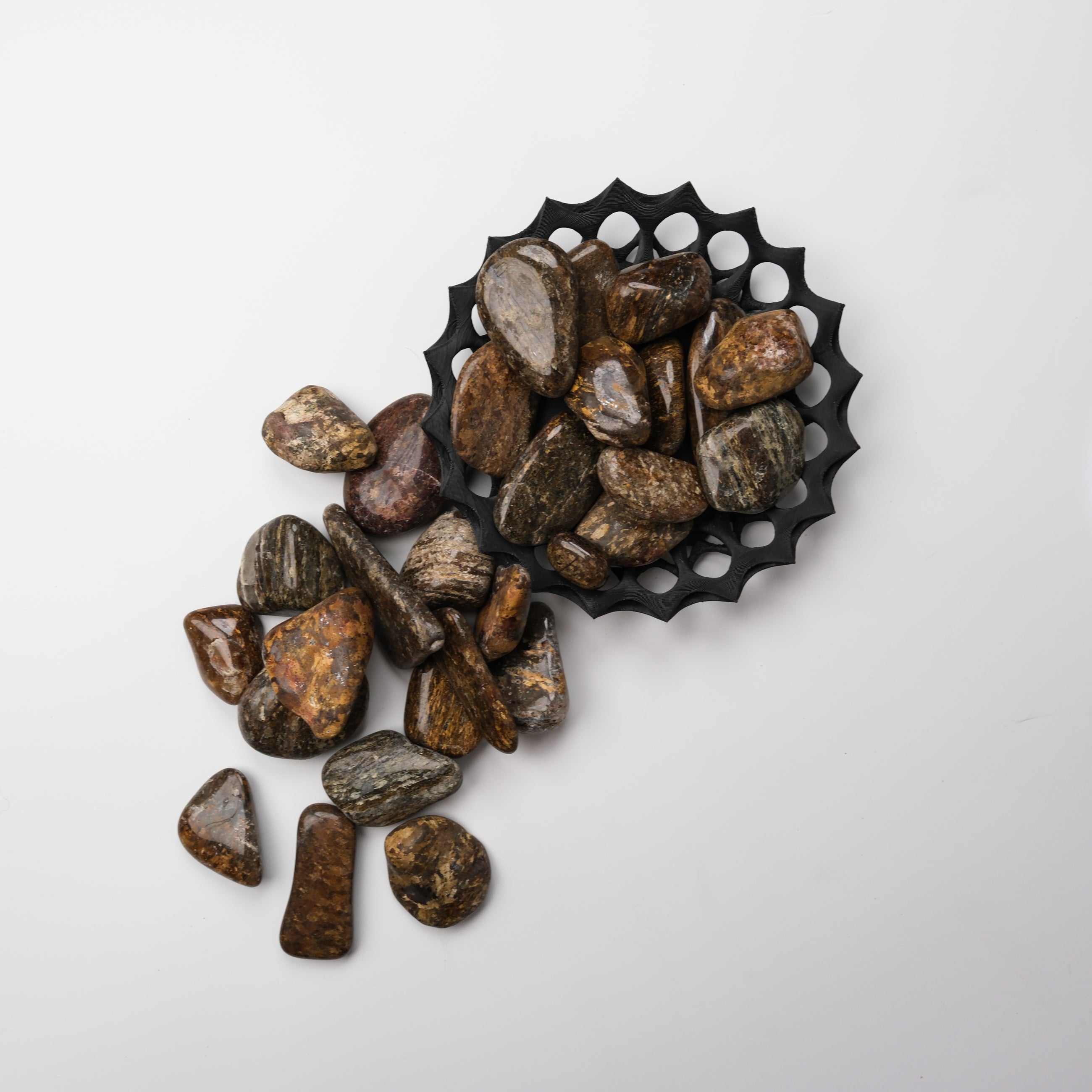 Bronzite tumble stone from Noctis Studio, showing smooth, polished natural mineral with warm bronze-brown hues and subtle striations.