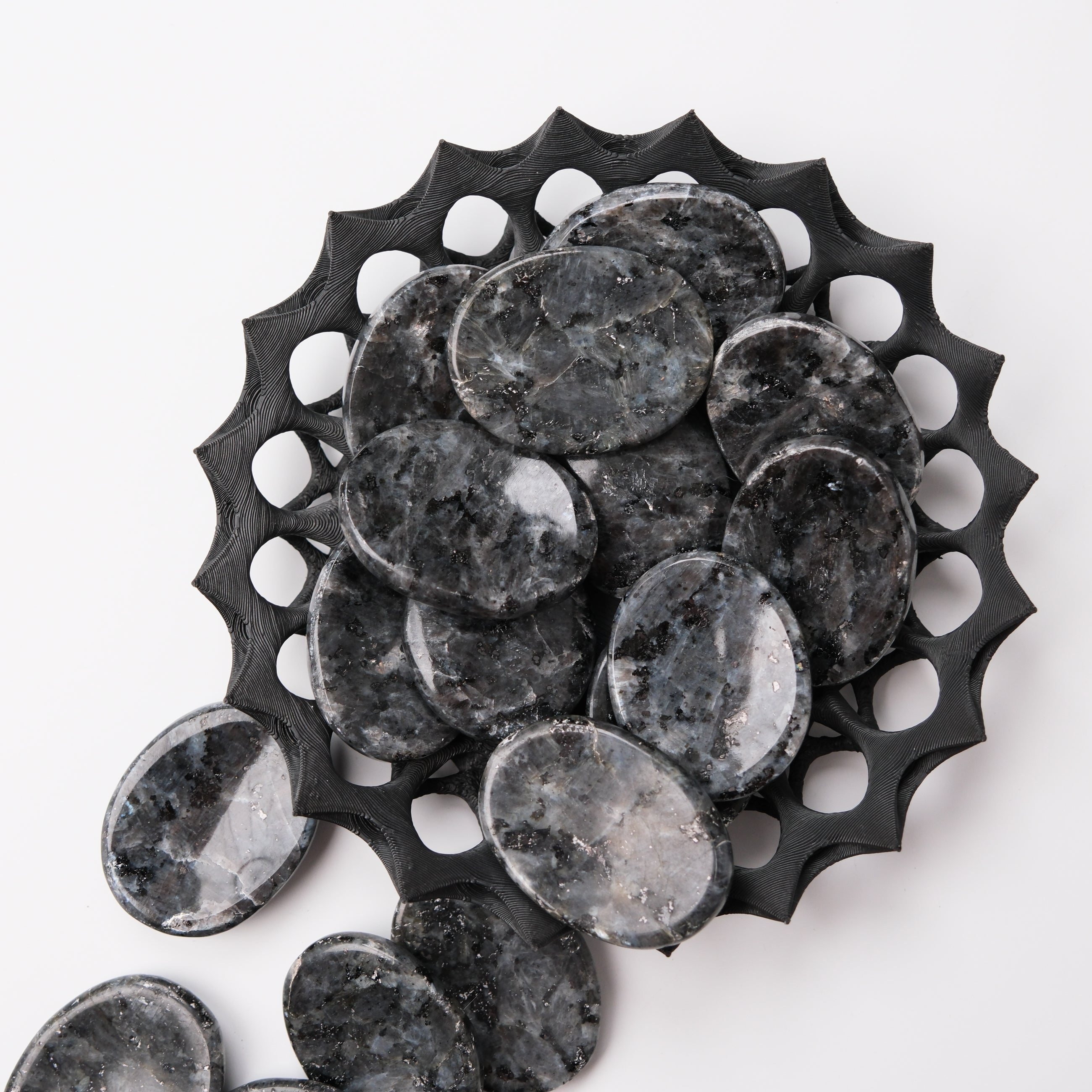 Larvikite worry stone by Noctis Studio, smooth polished gemstone for stress relief and meditation.