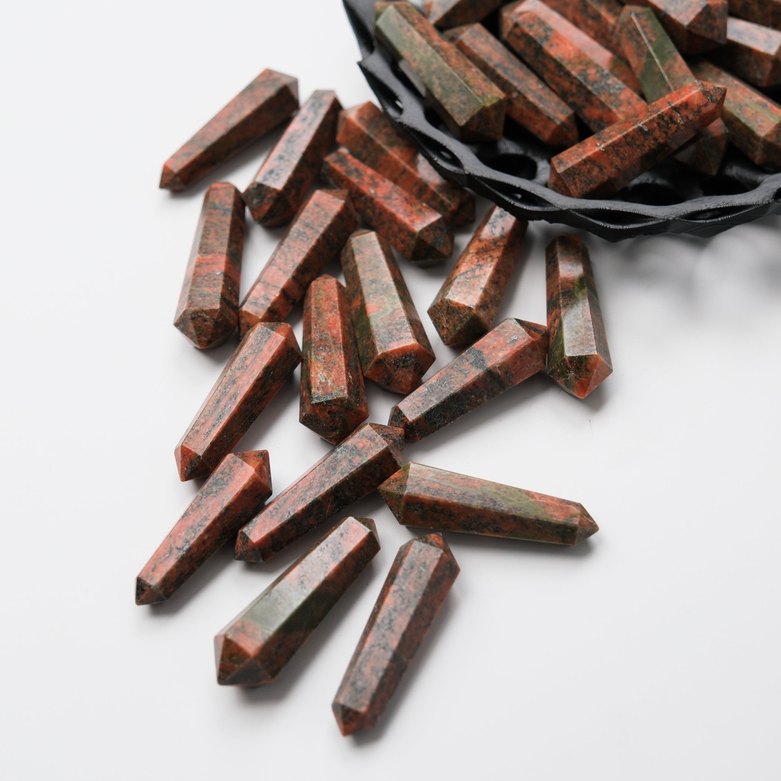 Noctis Studio Unakite Double Gridding Point, a gemstone tool with green and pink hues, used for crystal healing and energy work.
