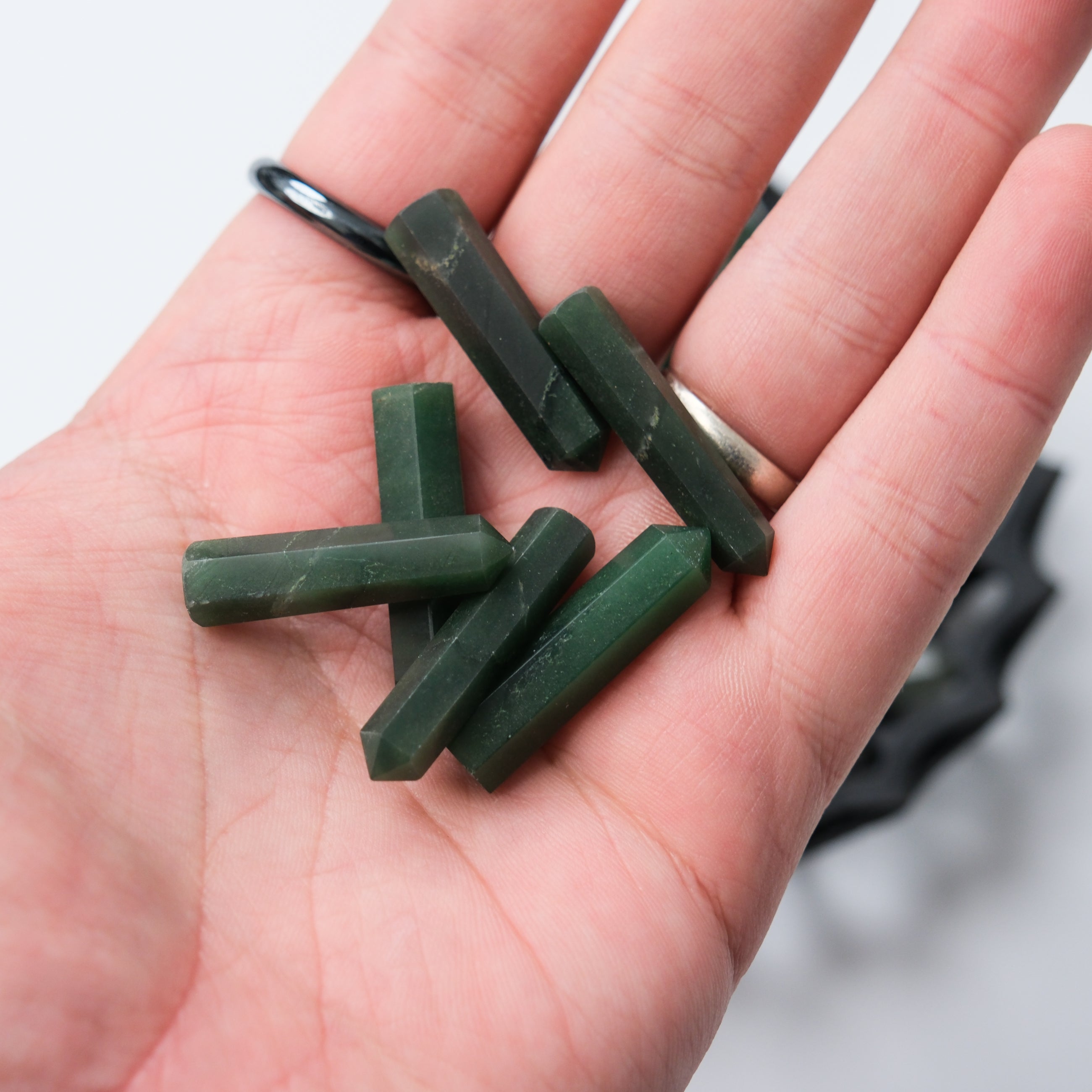 Dark green aventurine single gridding point from Noctis Studio, showing a smooth, polished gemstone with pointed tip for crystal healing.