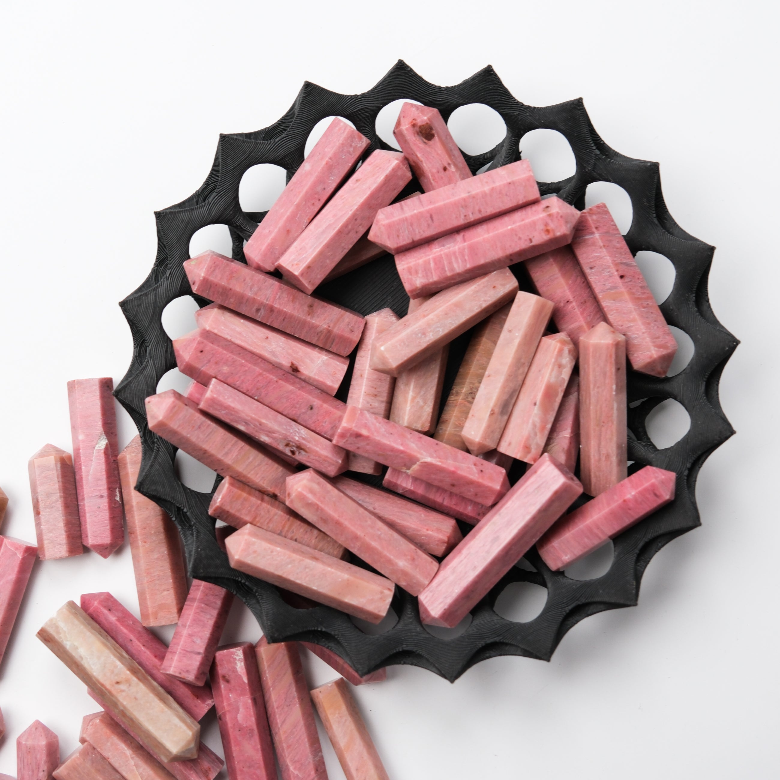 Pink petrified wood single gridding point from Noctis Studio, showcasing a natural stone tip with pink hues and detailed textures.