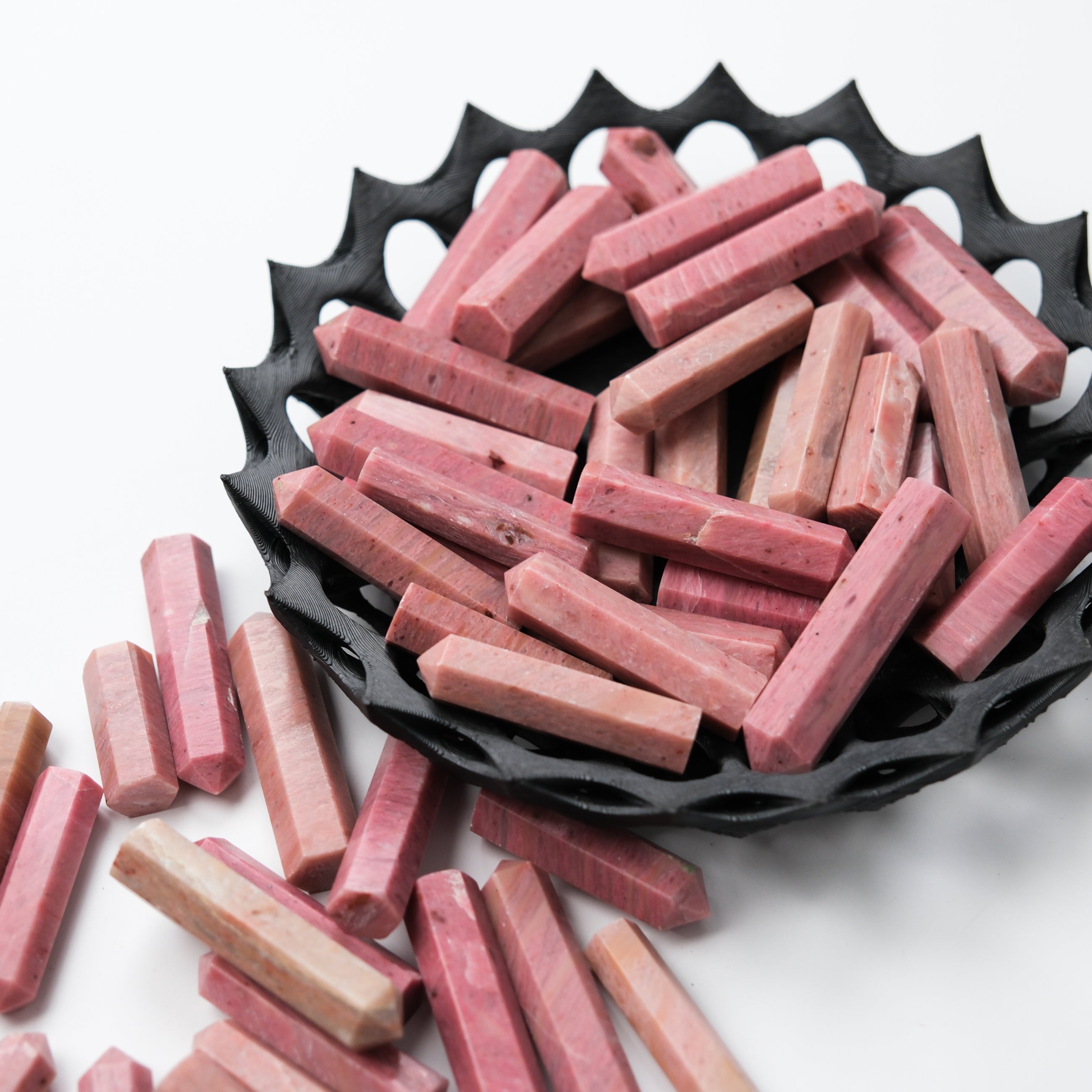 Pink petrified wood single gridding point from Noctis Studio, showcasing natural wood texture and pointed tip for crystal grid work.