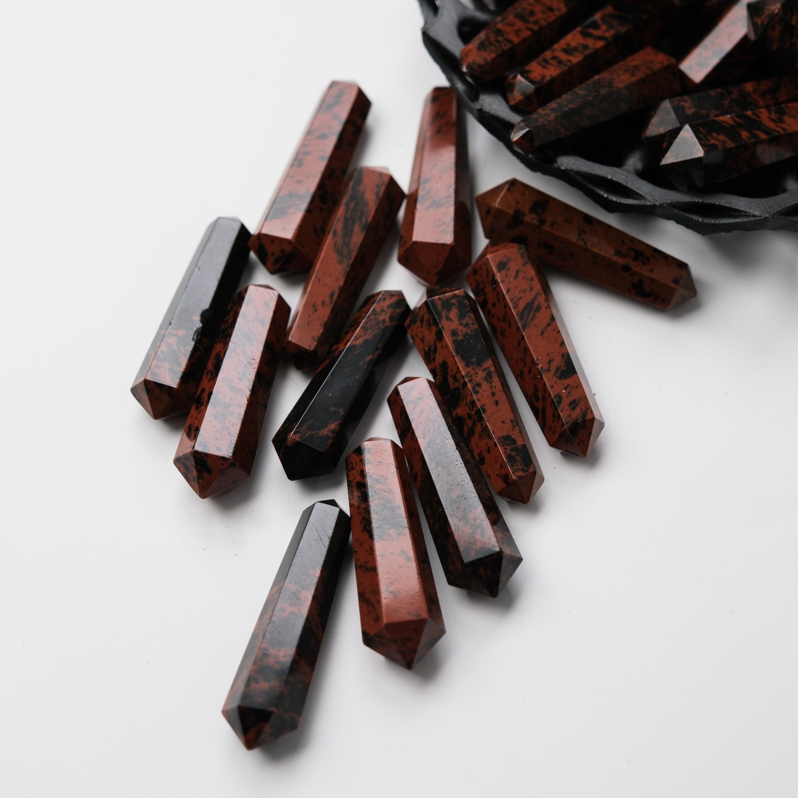 Noctis Studio Mahogany Obsidian Double Gridding Point with pointed tips and polished surface for crystal healing and energy work.