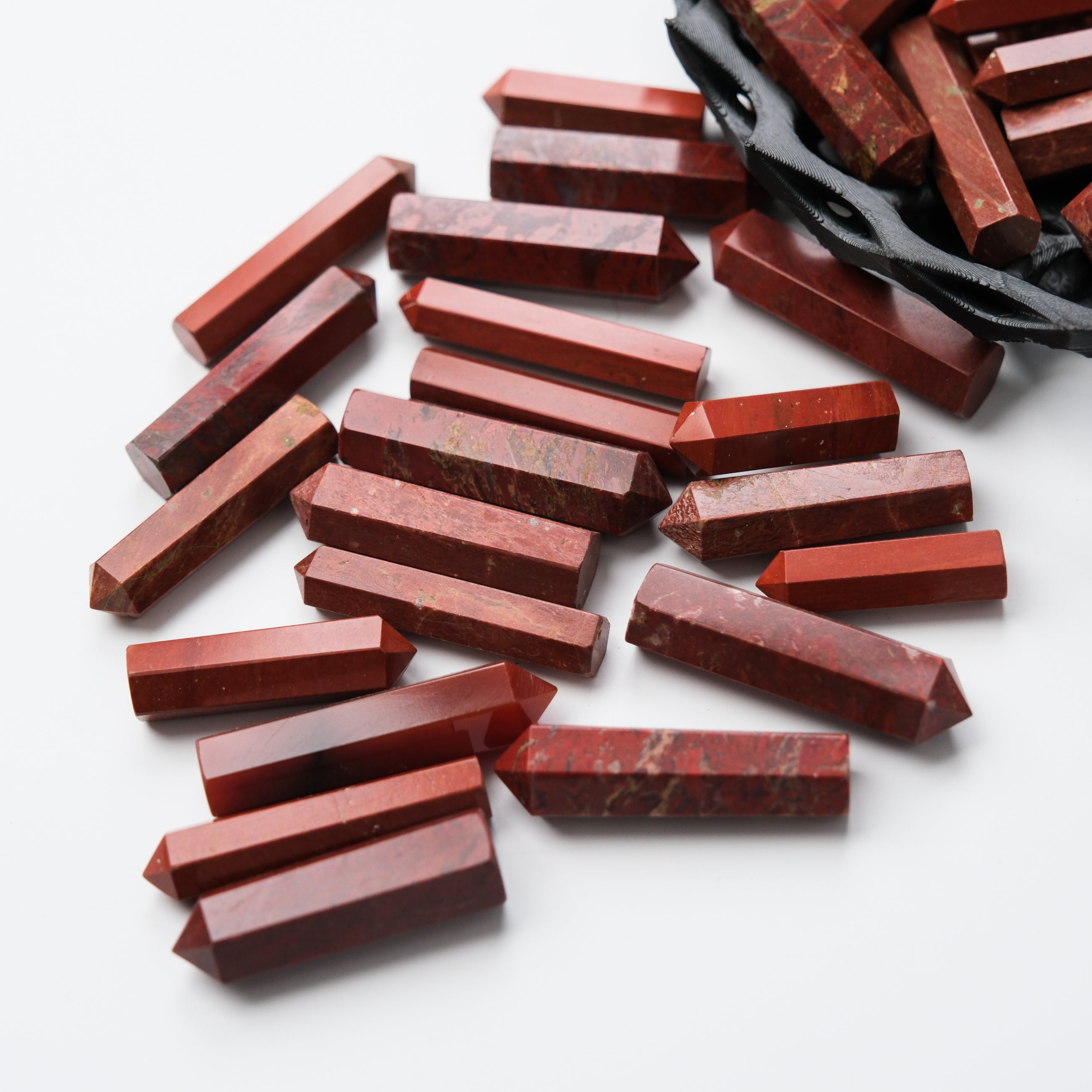 Red Jasper single gridding point by Noctis Studio, featuring a polished red jasper stone with a pointed tip for crystal grid work.