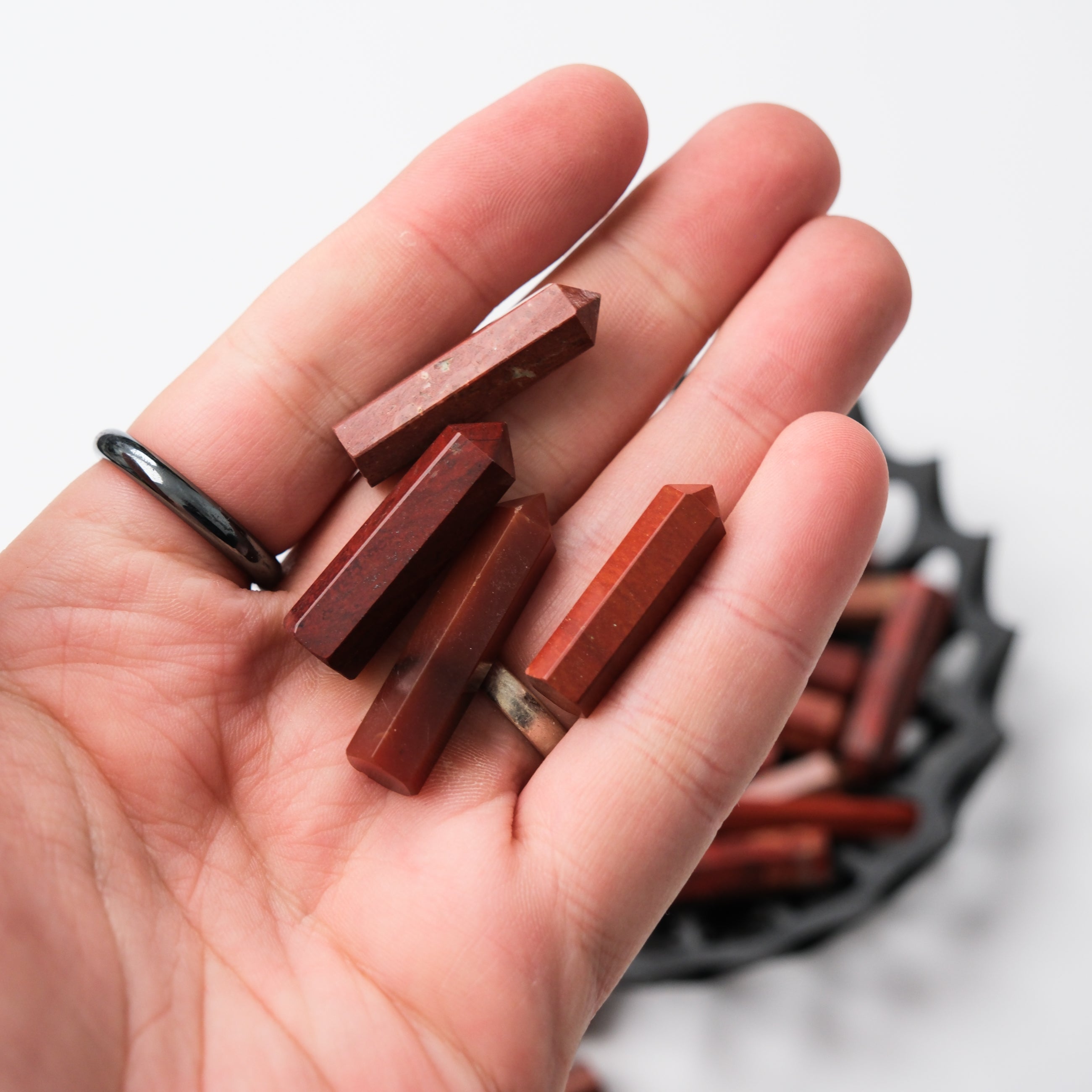 Red Jasper single gridding point by Noctis Studio, carved gemstone with a pointed tip for crystal grid work.