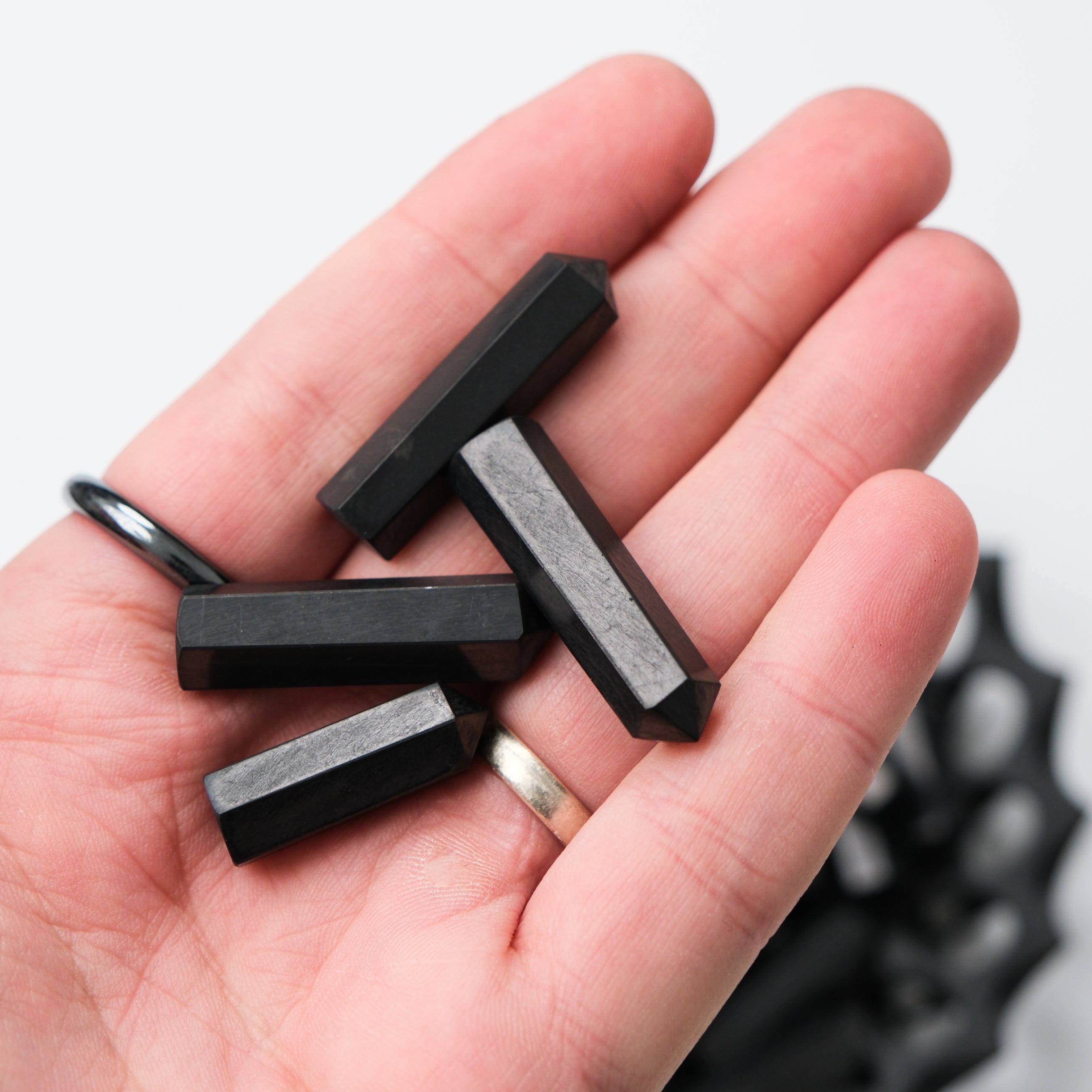 Shungite single gridding point from Noctis Studio, featuring a polished black stone with pointed tip for energy work and crystal grids.