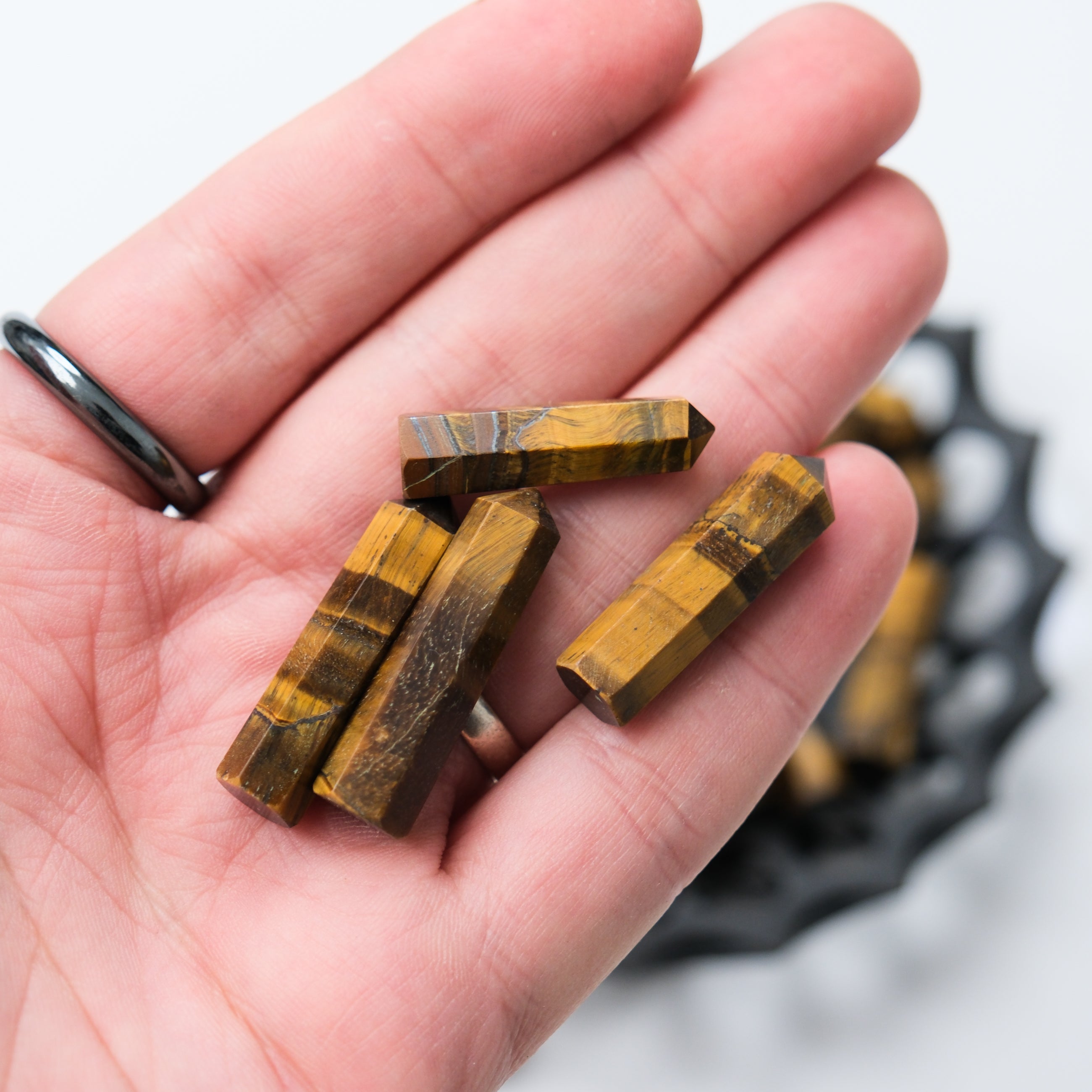Noctis Studio Tigers Eye single gridding point for jewelry making, featuring polished tiger's eye gemstone and precise metal setting.
