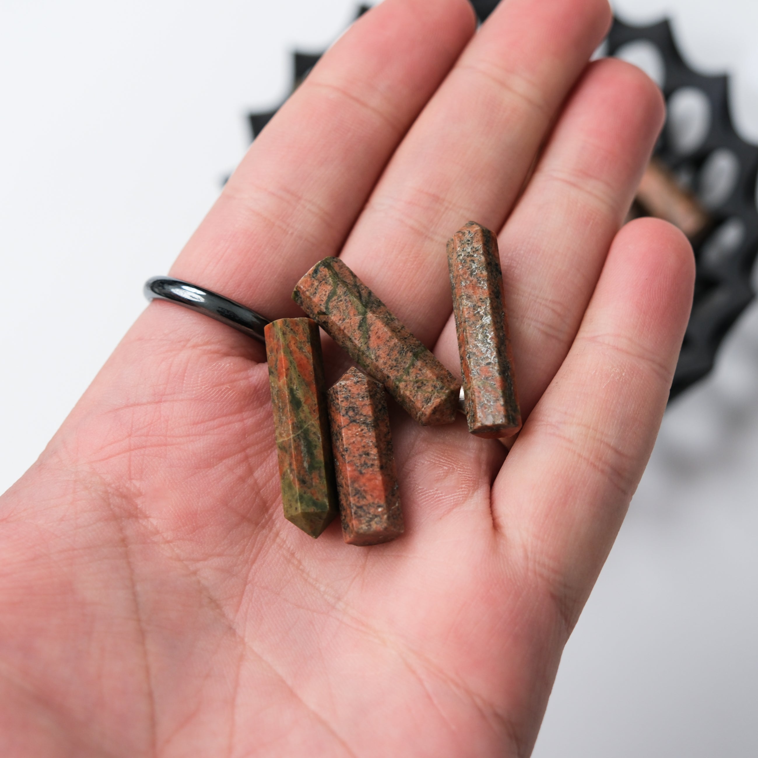 Unakite single gridding point by Noctis Studio, showing a polished green and pink gemstone tool used for crystal grid work.