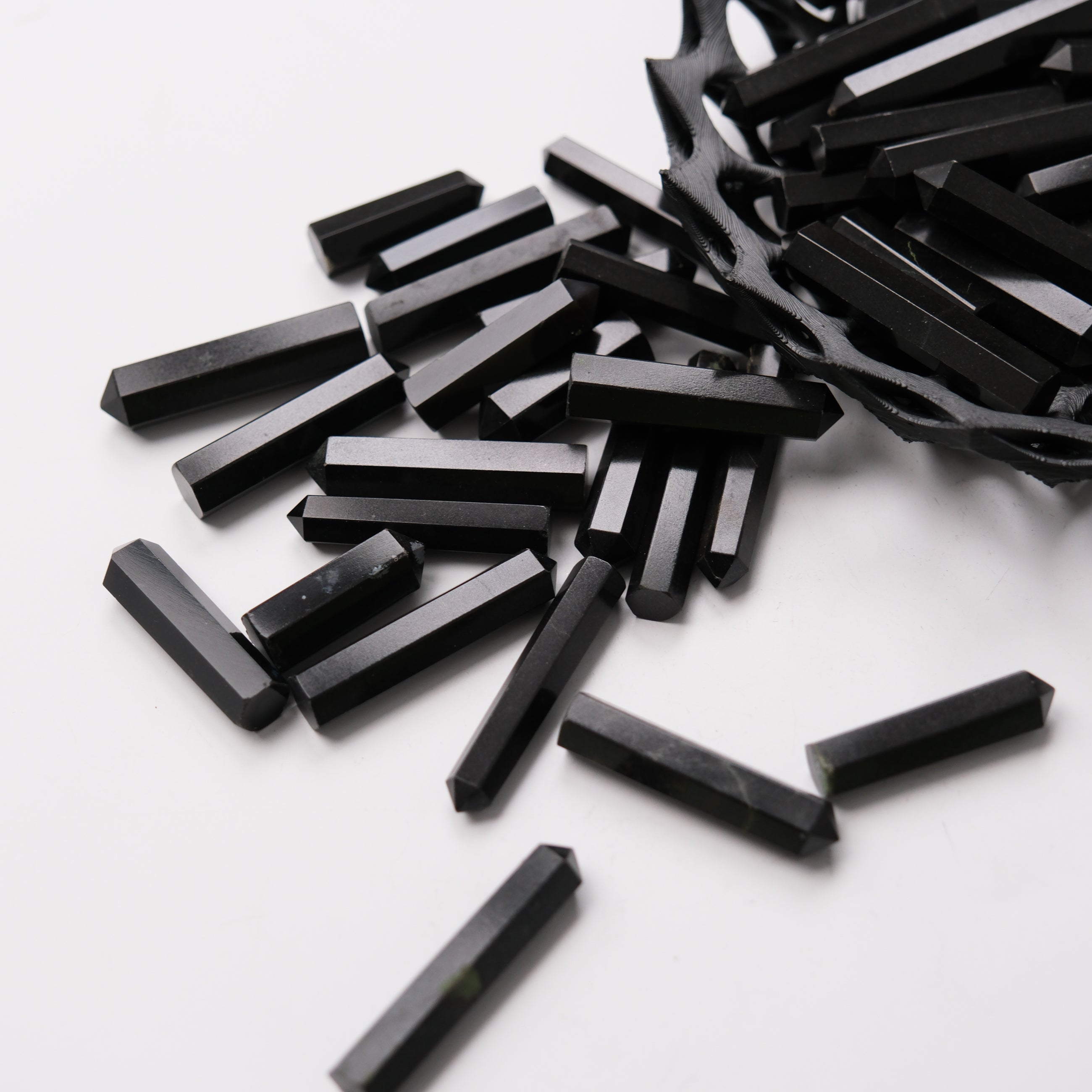 Noctis Studio Black Jasper Single Gridding Point with detailed natural stone texture and pointed tip for precise application.