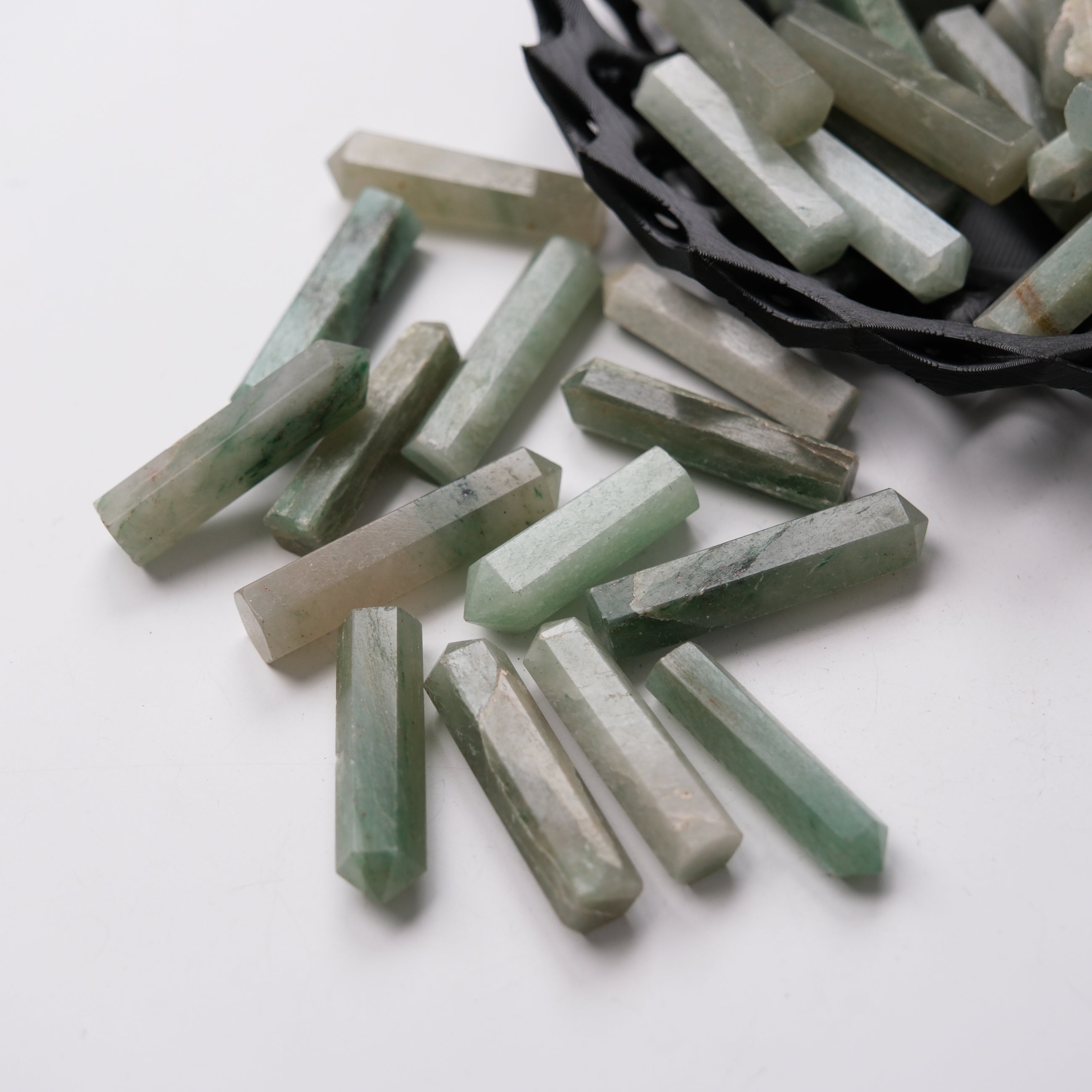 Green aventurine single gridding point from Noctis Studio, polished stone with pointed shape for crystal healing and energy work.