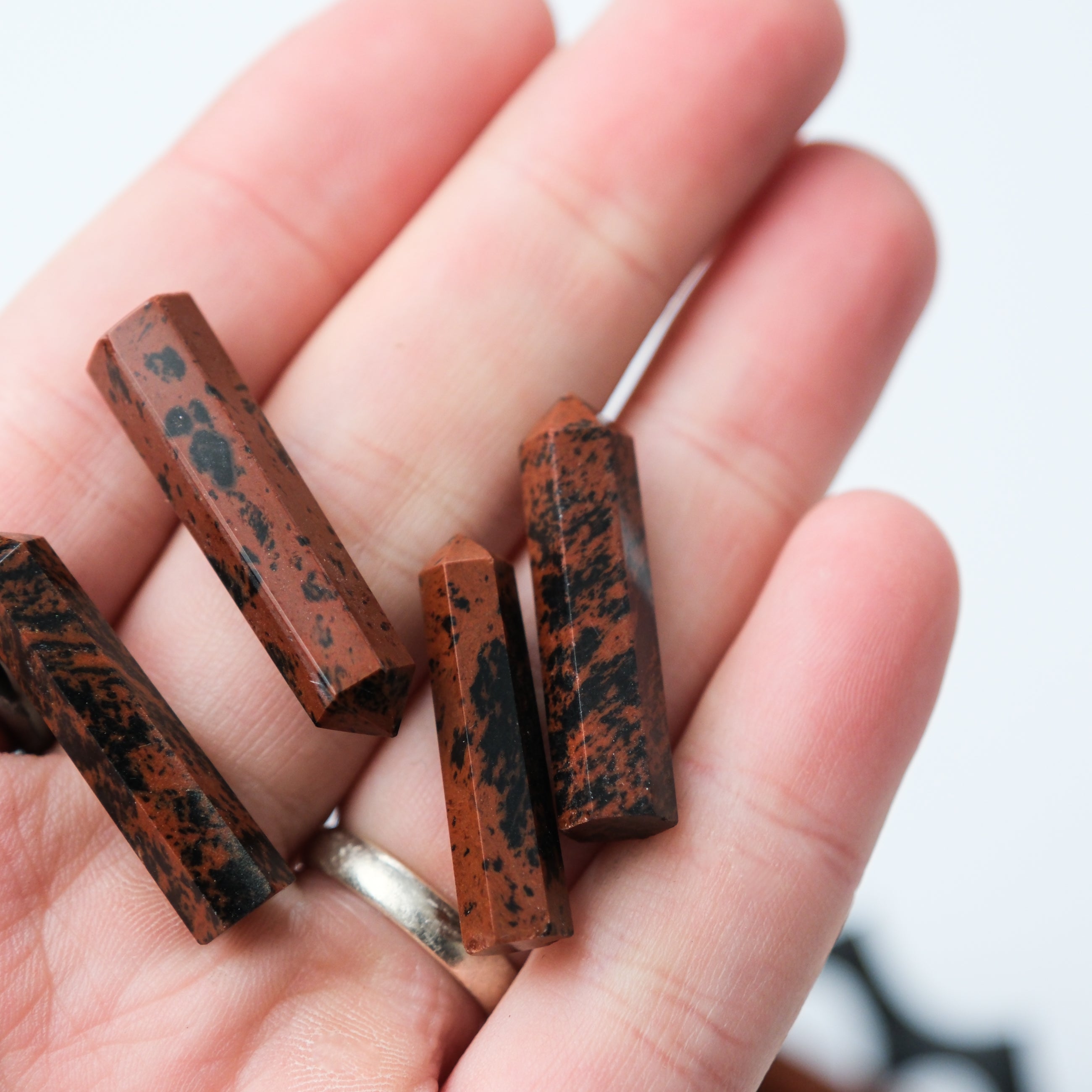 Mahogany Obsidian Single Gridding Point by Noctis Studio, a polished stone tool used for crystal grid work and energy focusing.
