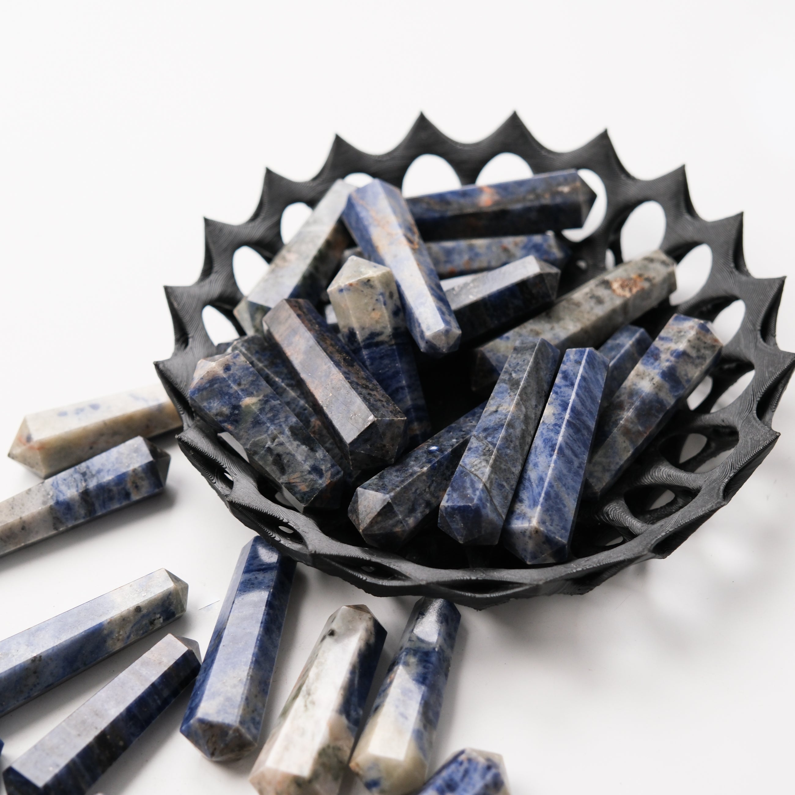 Sodalite double gridding point from Noctis Studio, featuring deep blue mineral with natural veining and polished surface.