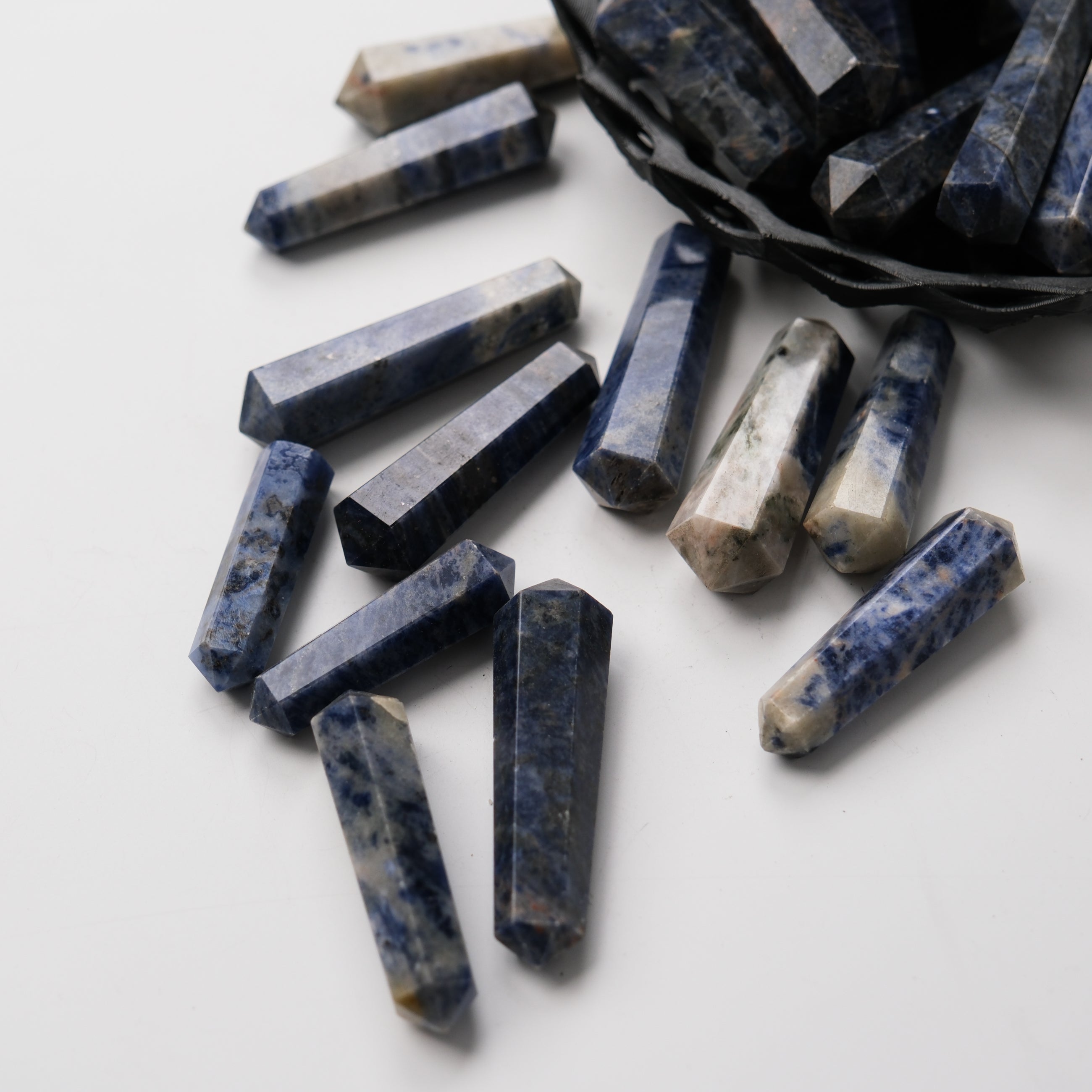 Sodalite double gridding point from Noctis Studio, featuring deep blue and white mineral patterns, used for crystal healing and energy work.