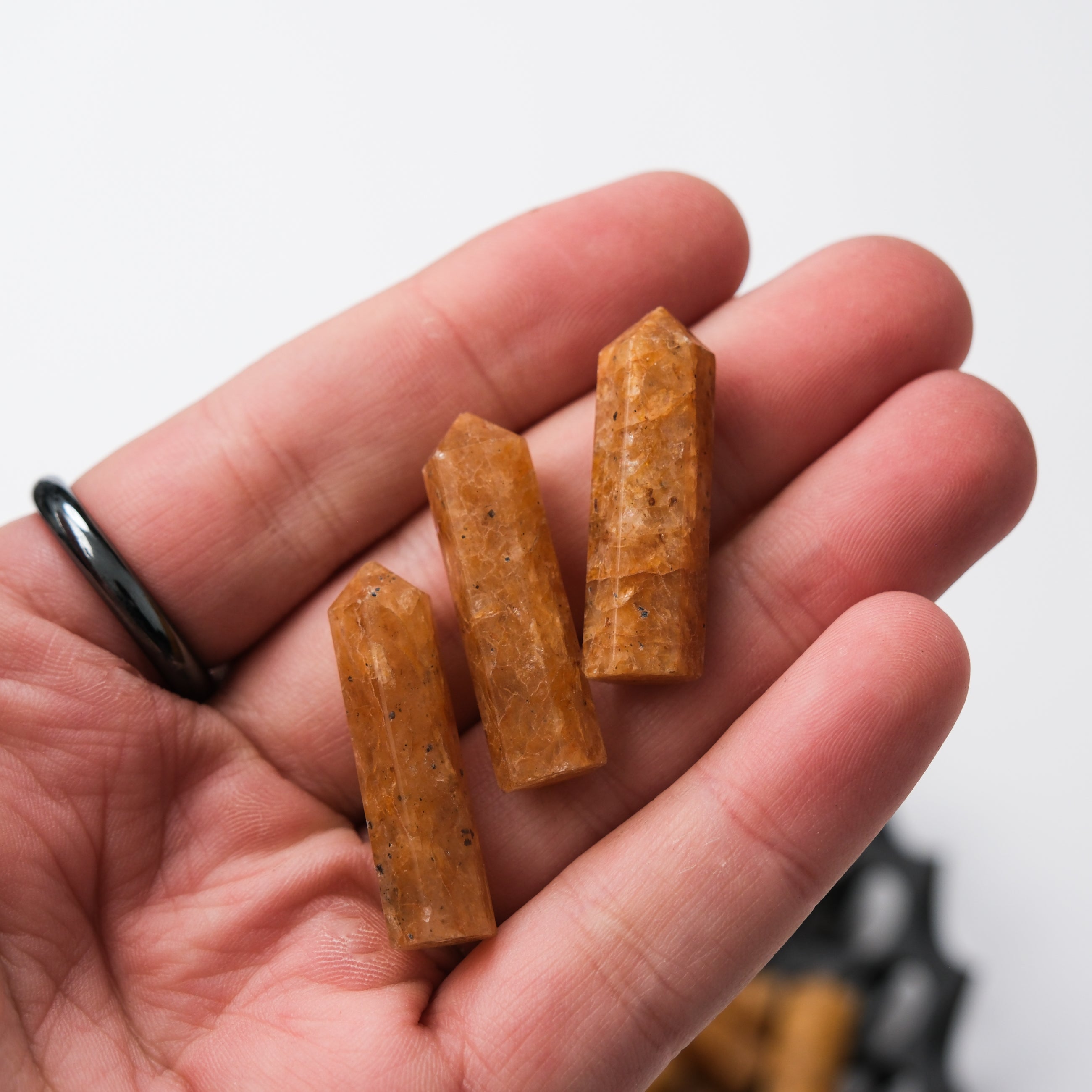 Golden Quartz single gridding point from Noctis Studio, featuring a polished golden quartz crystal for jewelry making.