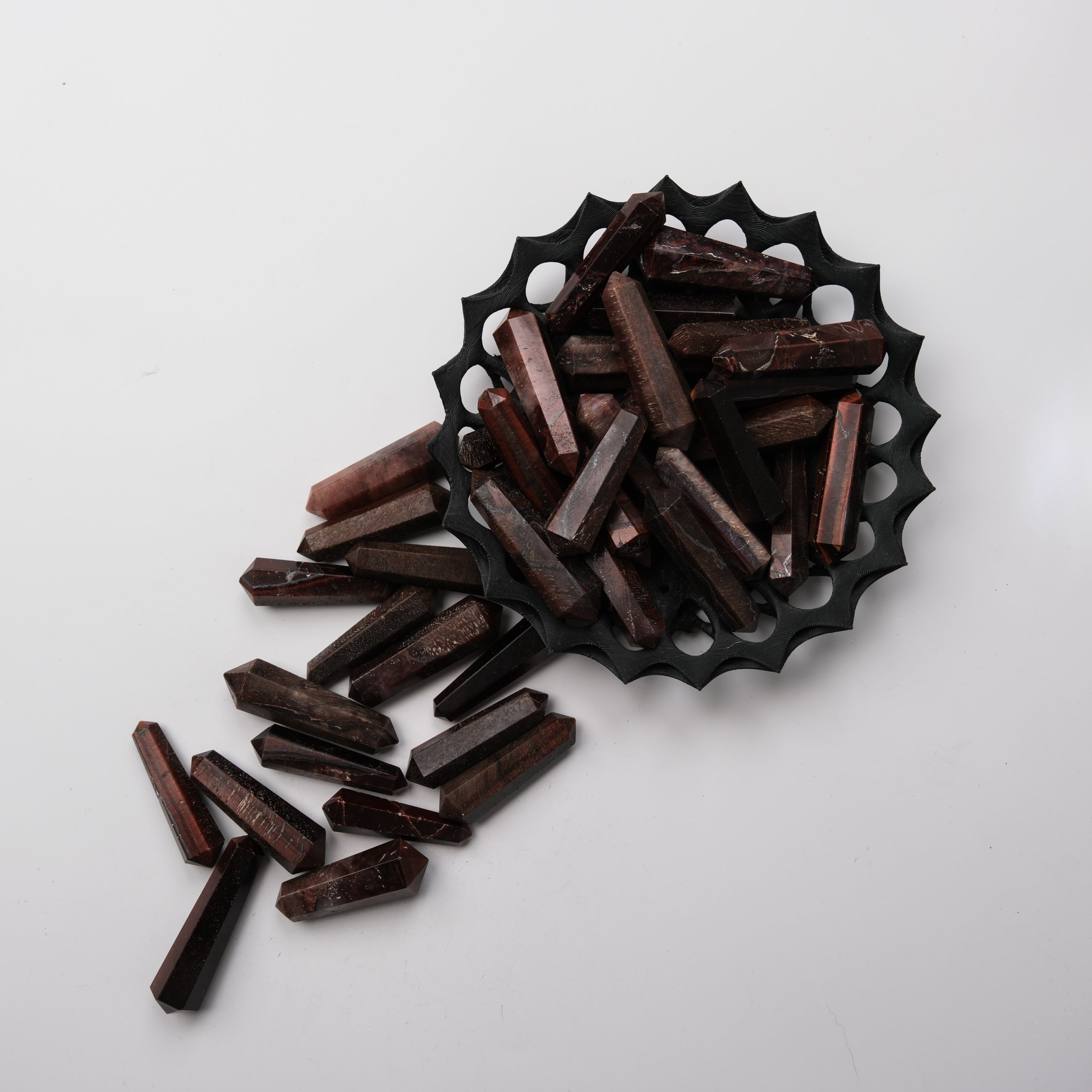 Red Tigers Eye double gridding point from Noctis Studio, featuring a polished, pointed gemstone for jewelry making or crafting.
