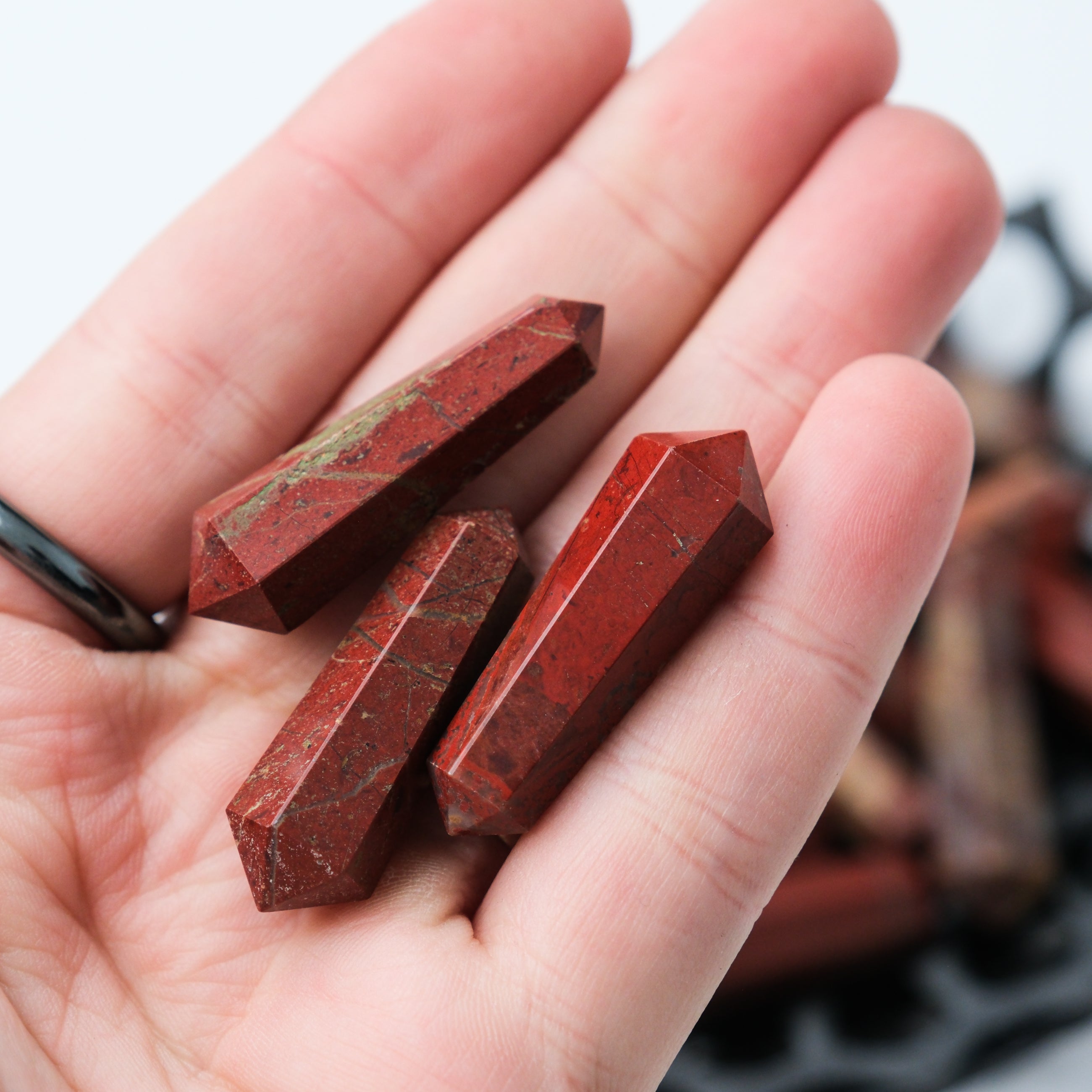 Red Jasper Double Gridding Point from Noctis Studio, detailed close-up showcasing the polished stone and intricate design.