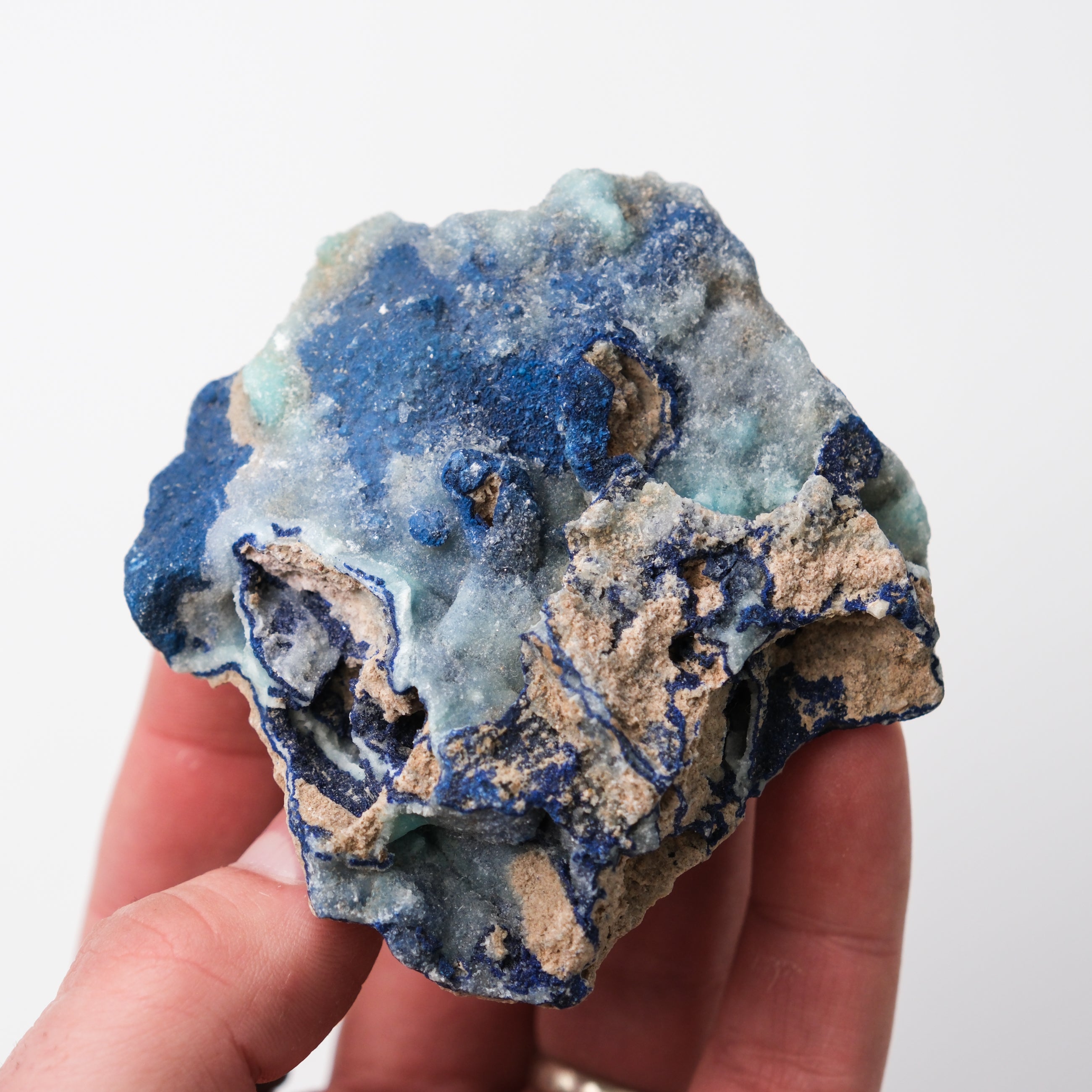 Azurite specimen from Noctis Studio showing vibrant deep blue mineral crystals on a rocky base.
