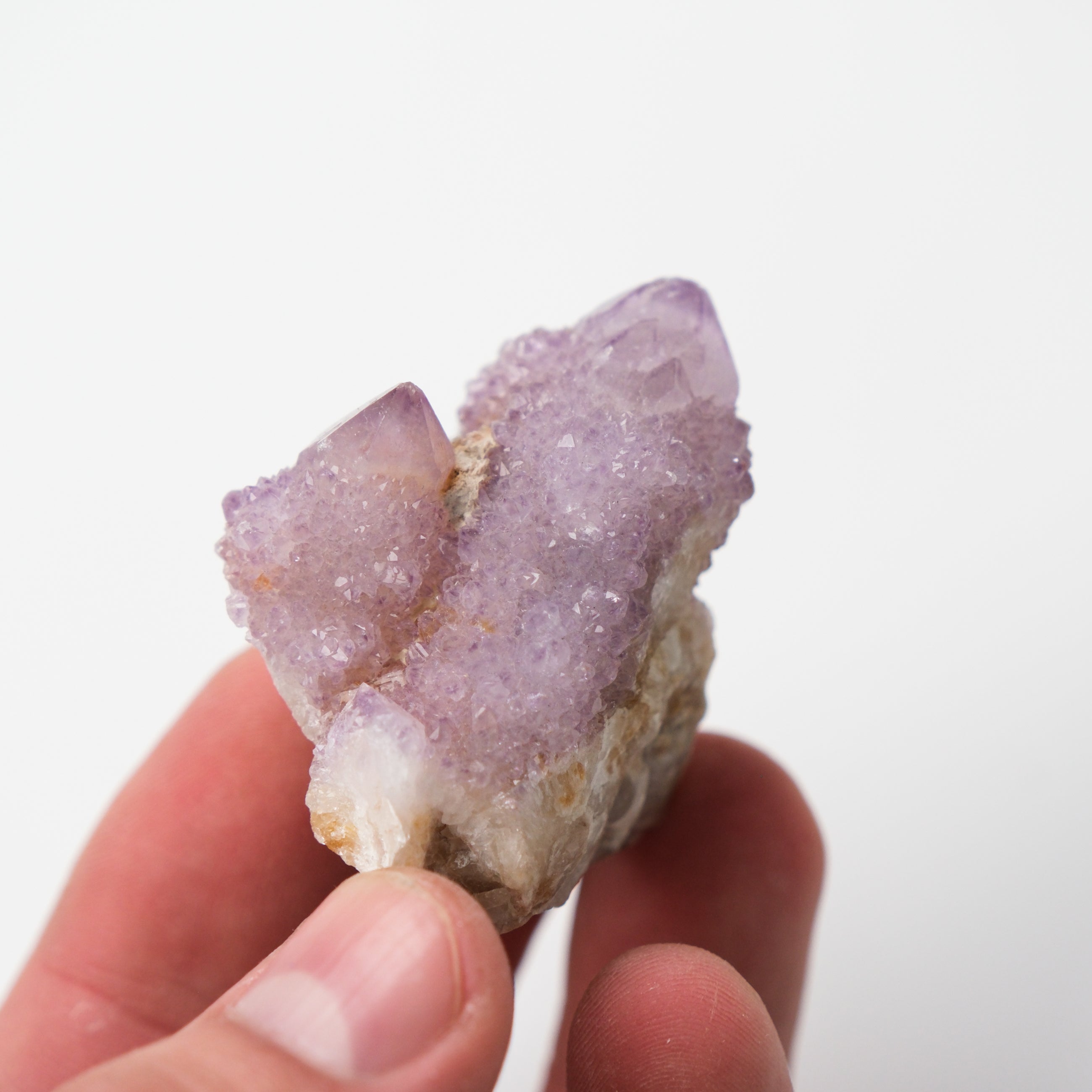 Cluster of clear spirit quartz crystals with a luminous, radiating formation, from Noctis Studio.