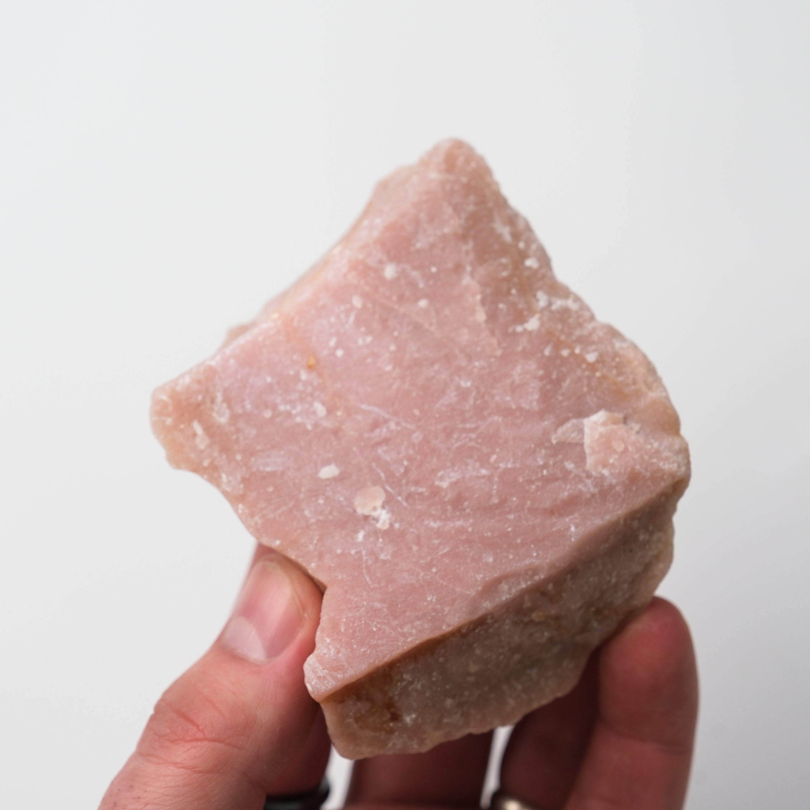 Pink Opal rough mineral specimen by Noctis Studio, showcasing its vibrant pink color and natural raw crystal formation.