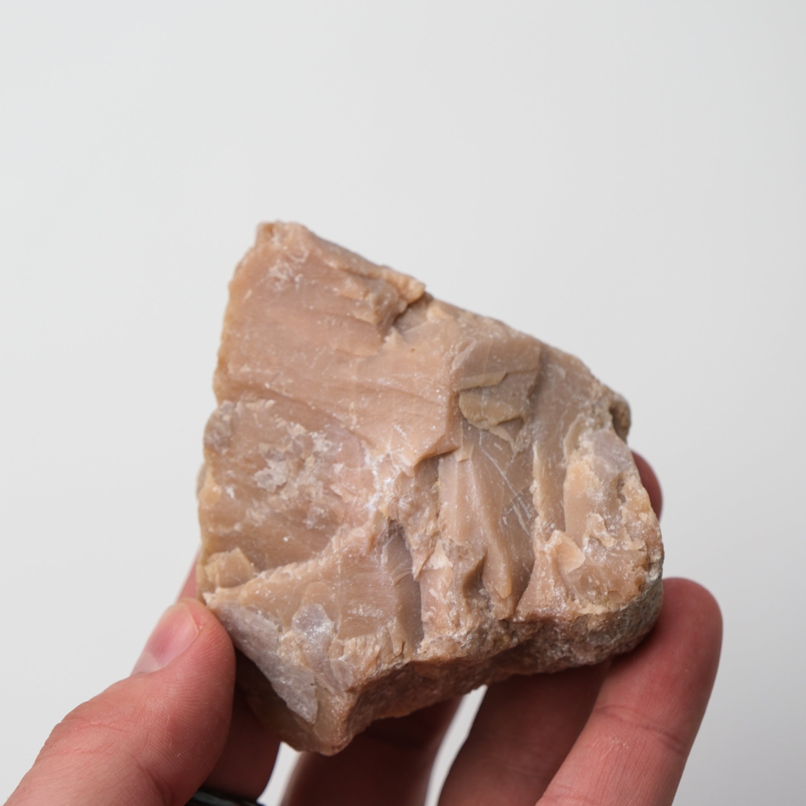 Pink Opal Rough gemstone from Noctis Studio, showing a textured, natural pink-colored mineral specimen on a neutral background.