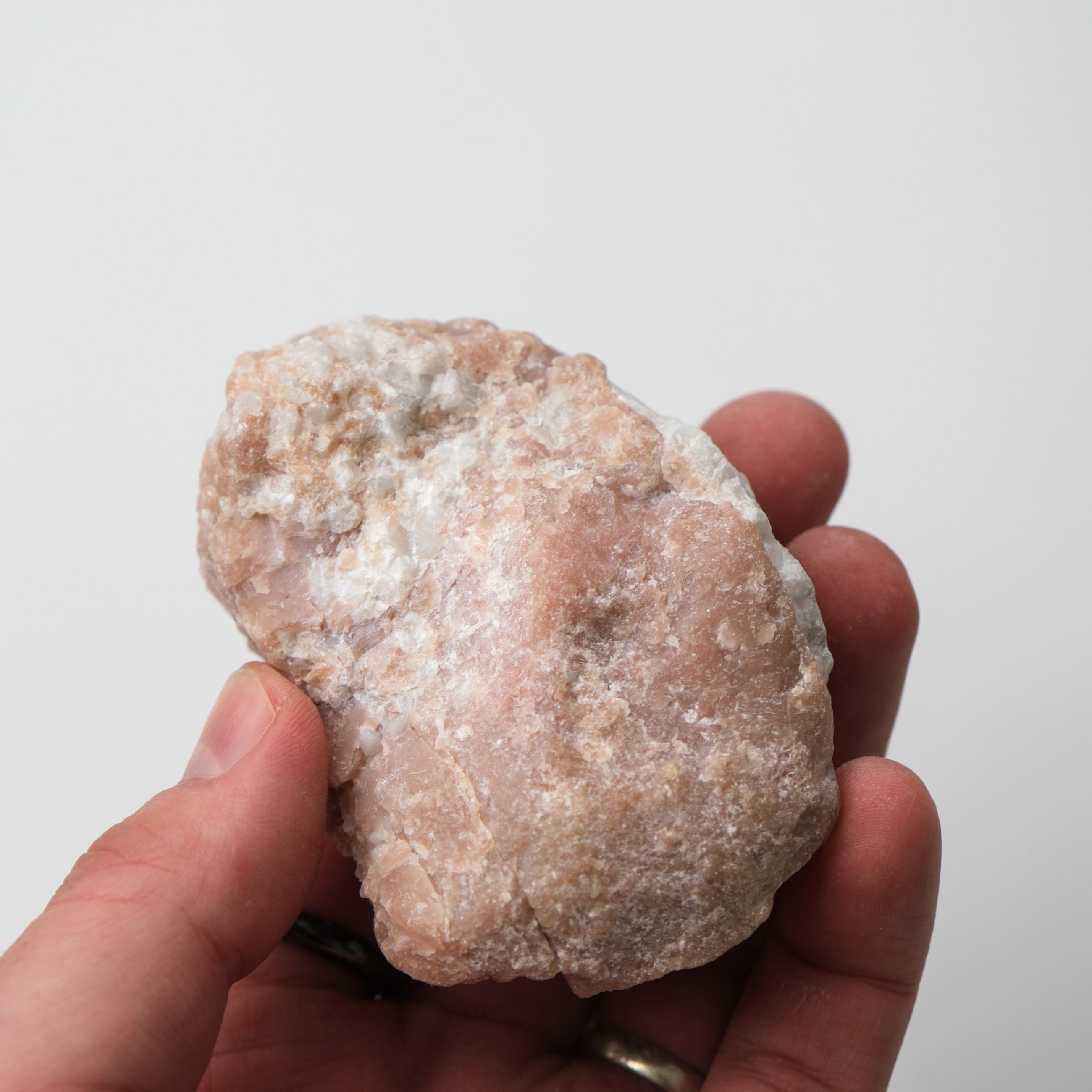 Pink Opal rough gemstone from Noctis Studio, showing a textured, unpolished pink opal specimen with natural variation.