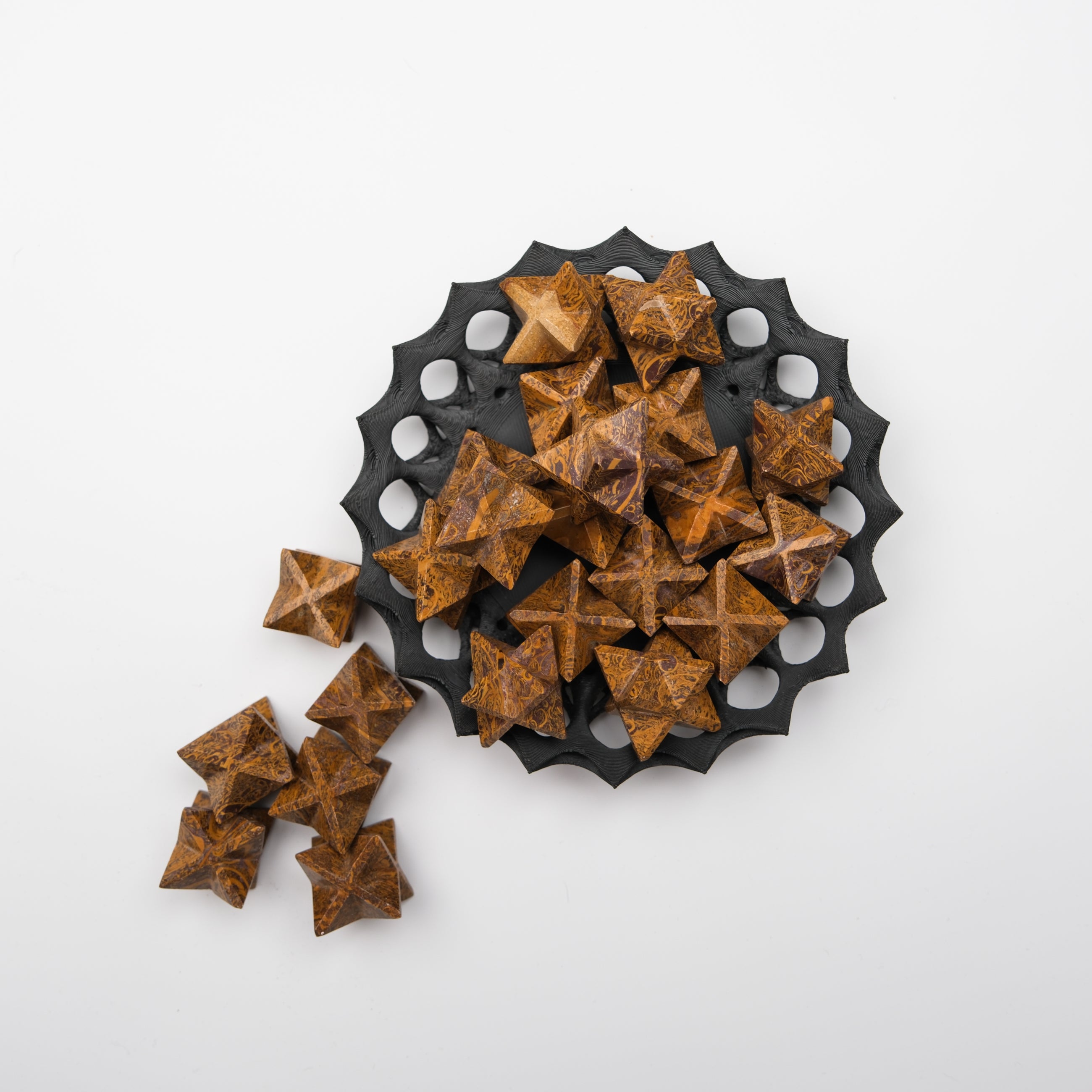 Star-shaped Snake Jasper stone from Noctis Studio, showcasing its unique pattern and glossy finish.