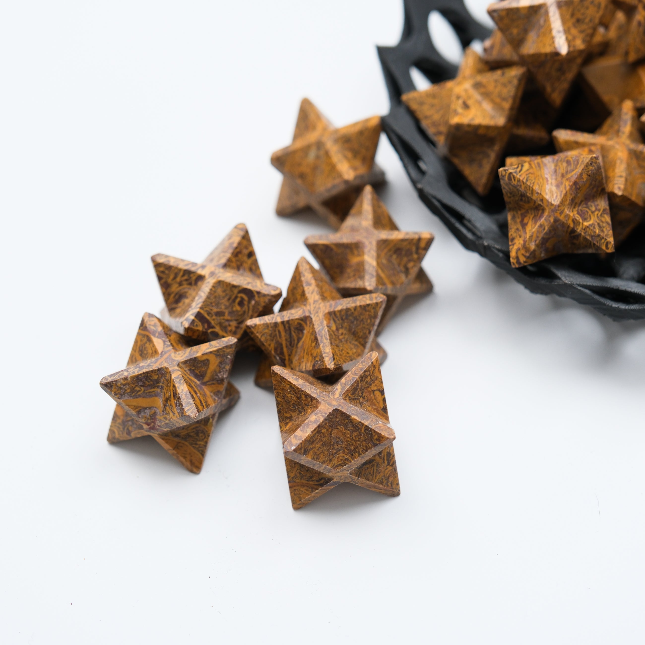 Star-shaped Snake Jasper gemstone from Noctis Studio, showcasing its natural brown and beige pattern and smooth polished surface.