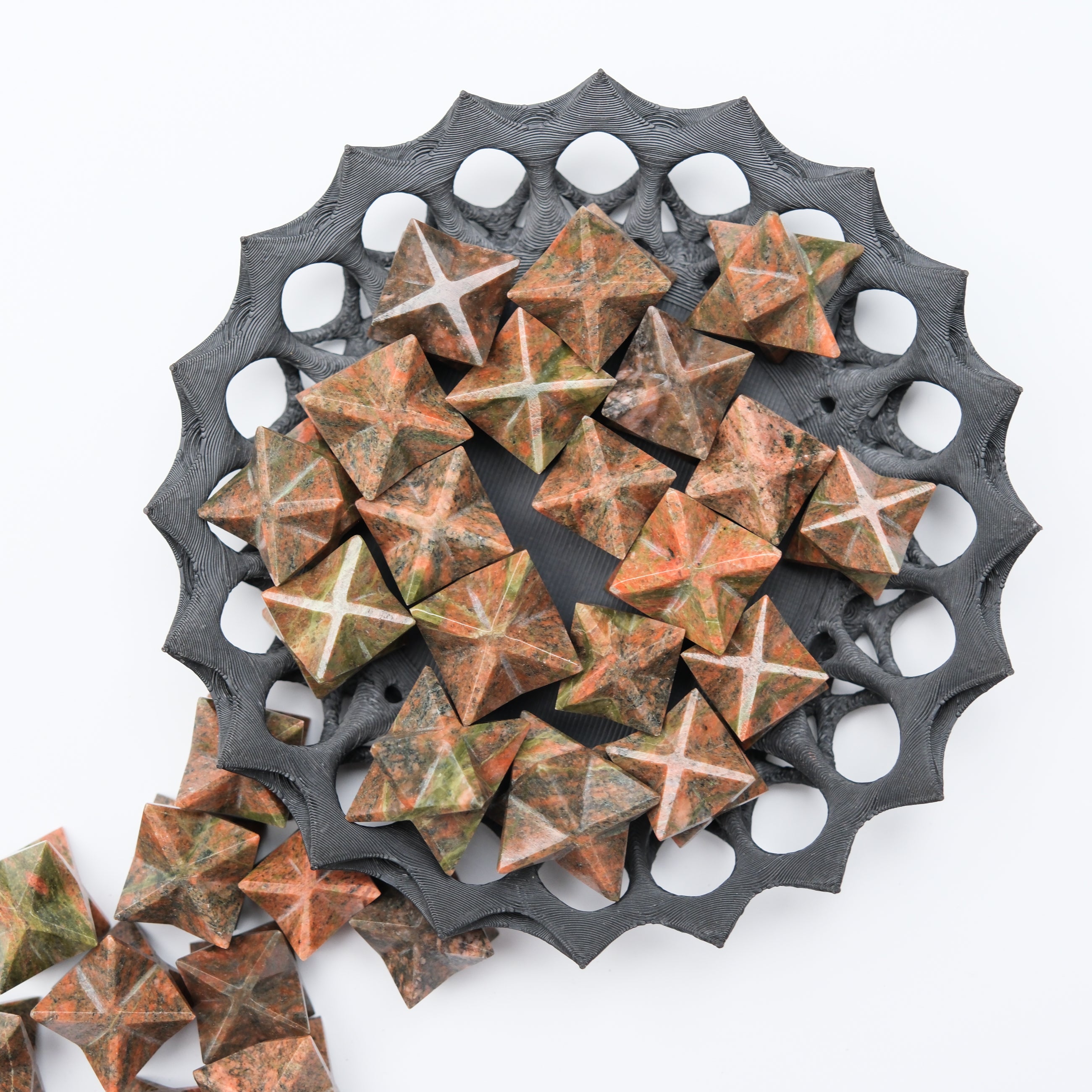 Unakite star-shaped gemstone pendant from Noctis Studio, showcasing a polished, natural pink and green unakite stone.