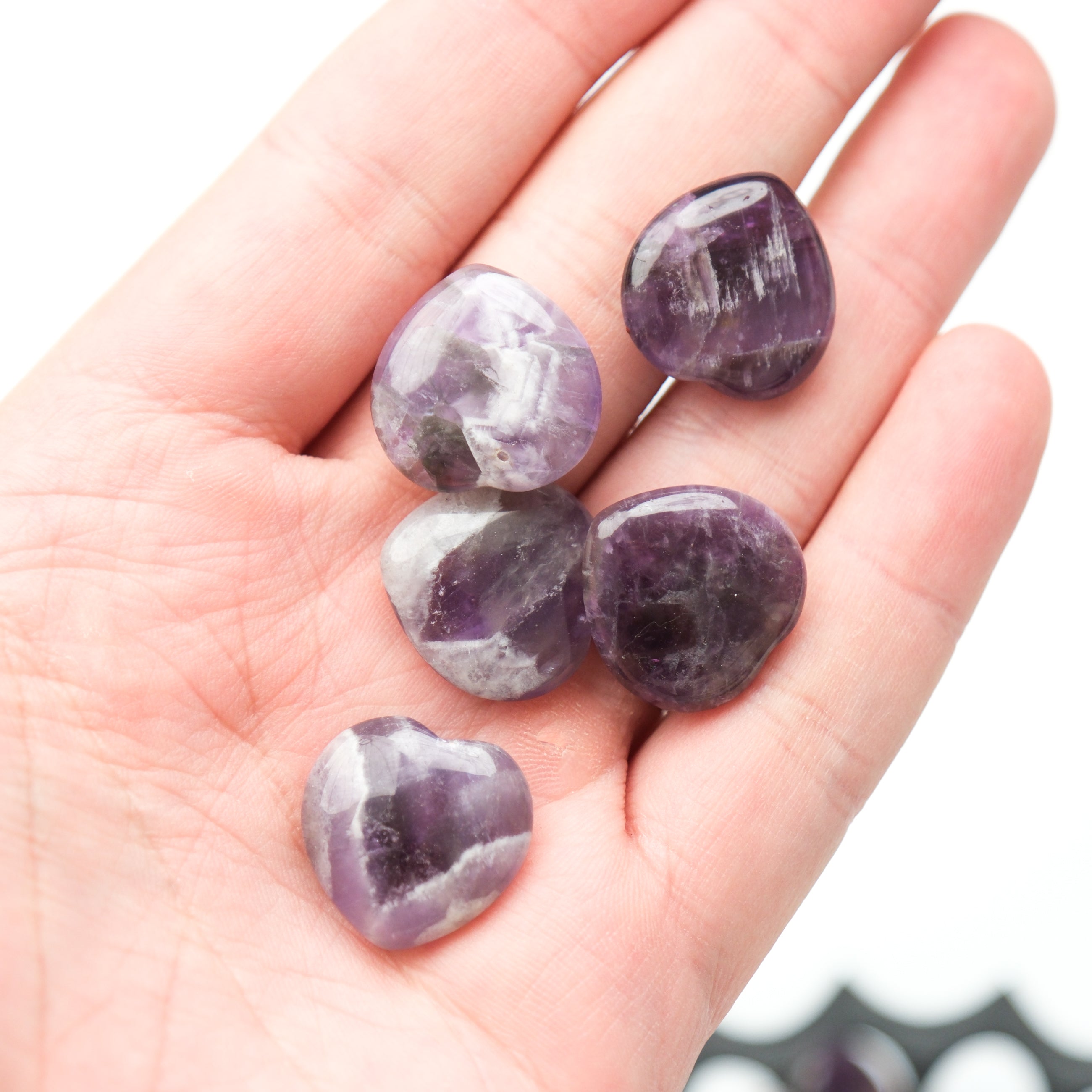 Small amethyst heart pendant from Noctis Studio, featuring a polished purple gemstone in a heart shape.