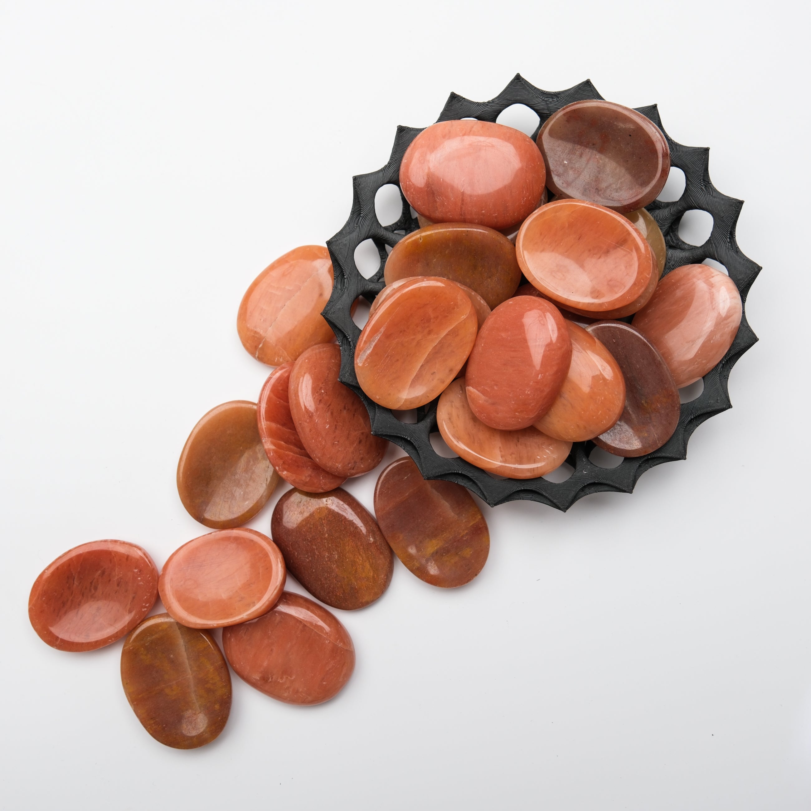 Peach aventurine worry stone from Noctis Studio showing smooth, polished surface with natural peach color and subtle veining.