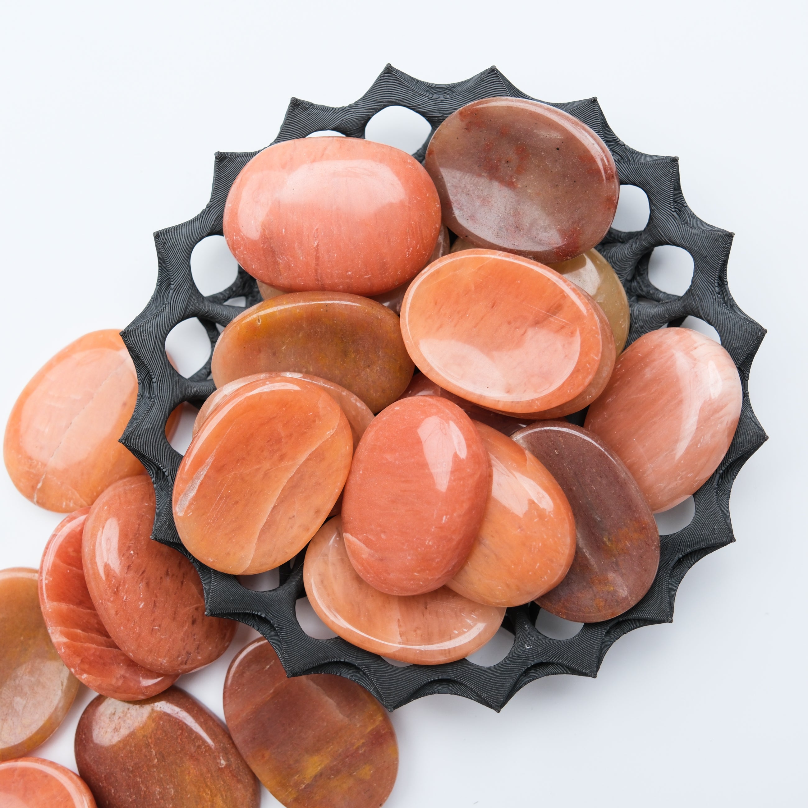 Peach aventurine worry stone by Noctis Studio showing smooth, polished gemstone with natural peach color and subtle marbling details.