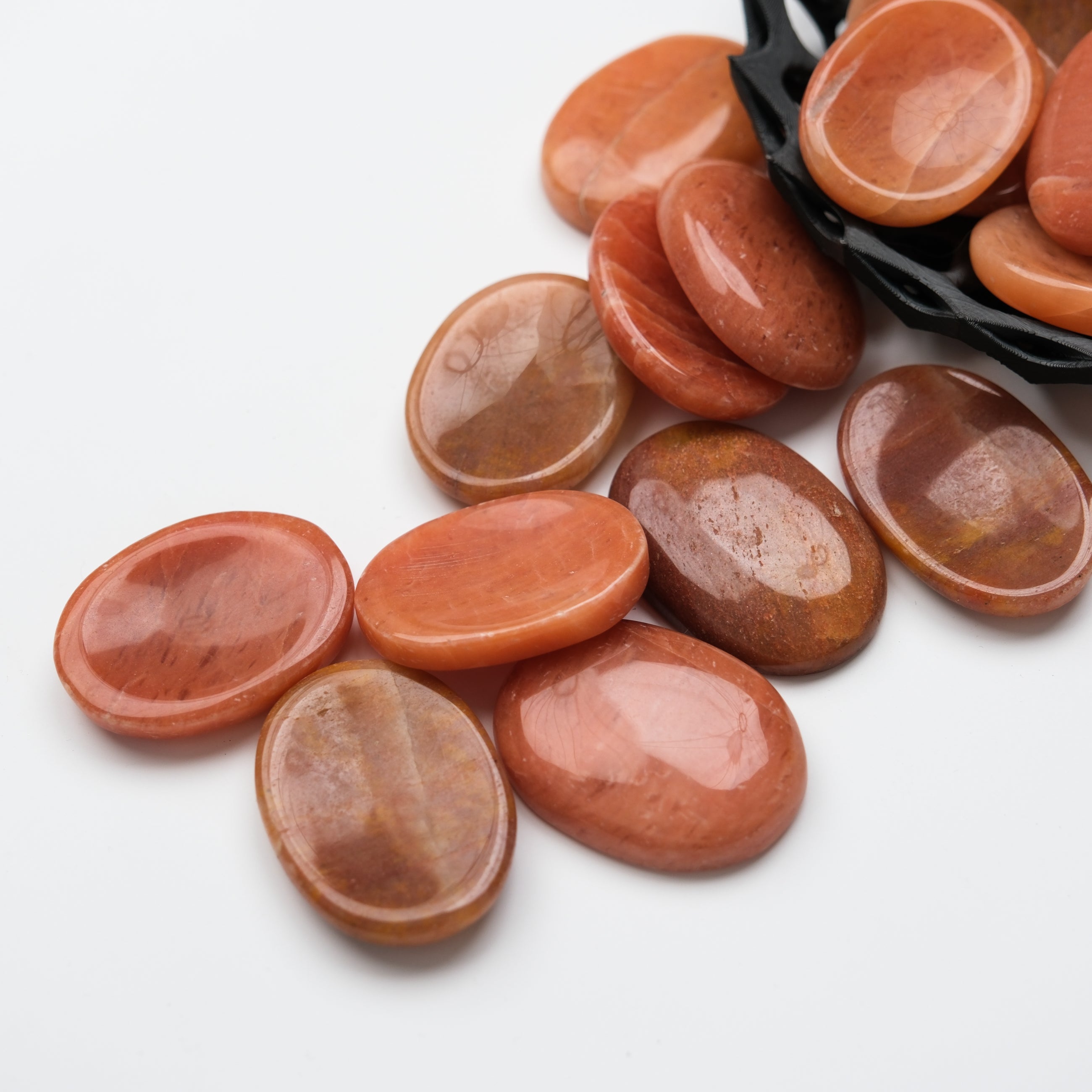 Peach aventurine worry stone from Noctis Studio, smooth polished gemstone for calming stress relief and meditation.