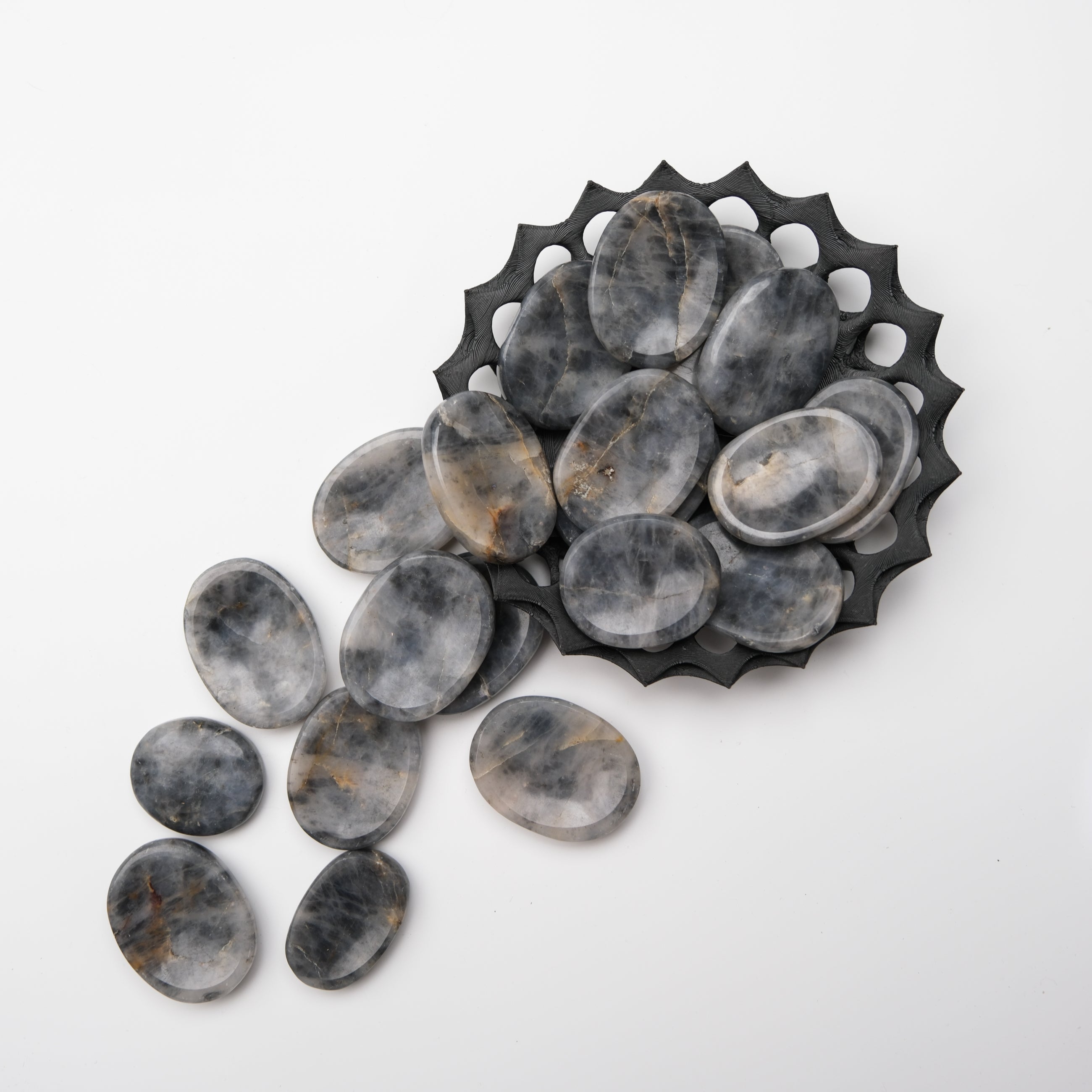 Iolite worry stone from Noctis Studio, smooth polished gemstone for stress relief and meditation.